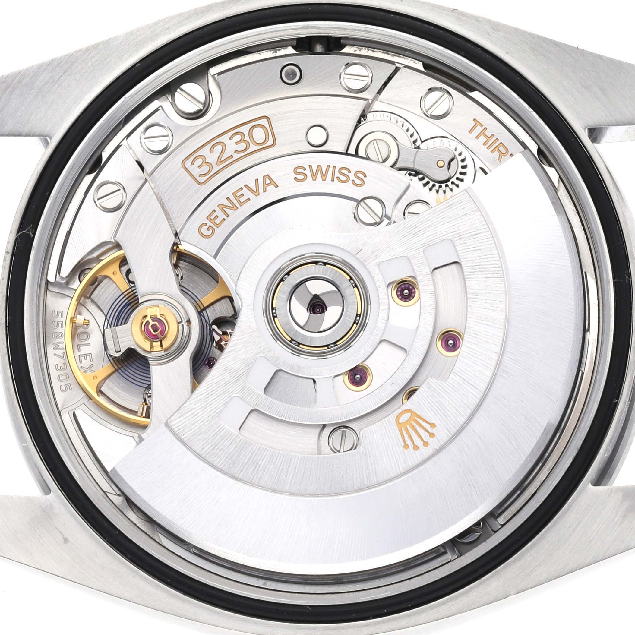 The image shows the backside of a Rolex Explorer 124270 Men
s Stainless Steel Black Dial 124270 Men
s Stainless Steel Black Dial watch, revealing the inner mechanical movement.