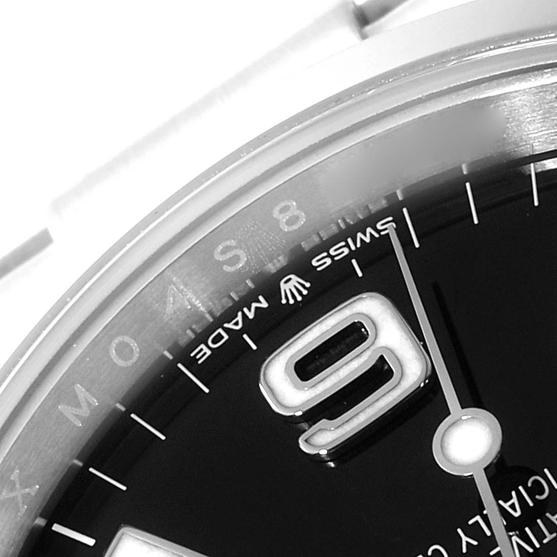 This image shows a close-up of the dial and bezel of the Rolex Explorer 124270 Men
s Stainless Steel Black Dial 124270 Men
s Stainless Steel Black Dial model, focusing on the "9" marker and "Swiss Made" text.