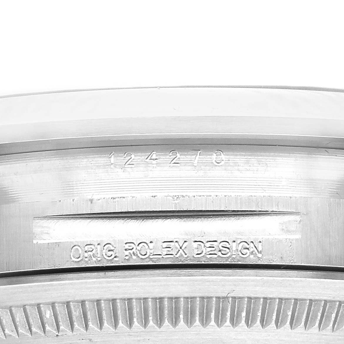 The image shows an angled close-up of the bezel and engraving on the back of a Rolex Explorer 124270 Men
s Stainless Steel Black Dial 124270 Men
s Stainless Steel Black Dial watch.