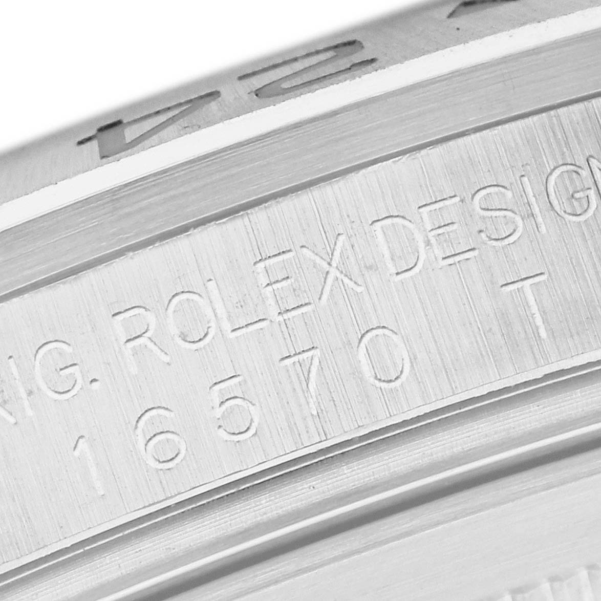 The image shows a close-up of the engraved case side of a Rolex Explorer 16570 Men's Stainless Steel White Dial 16570 Men's Stainless Steel White Dial watch, including the model number 16570.