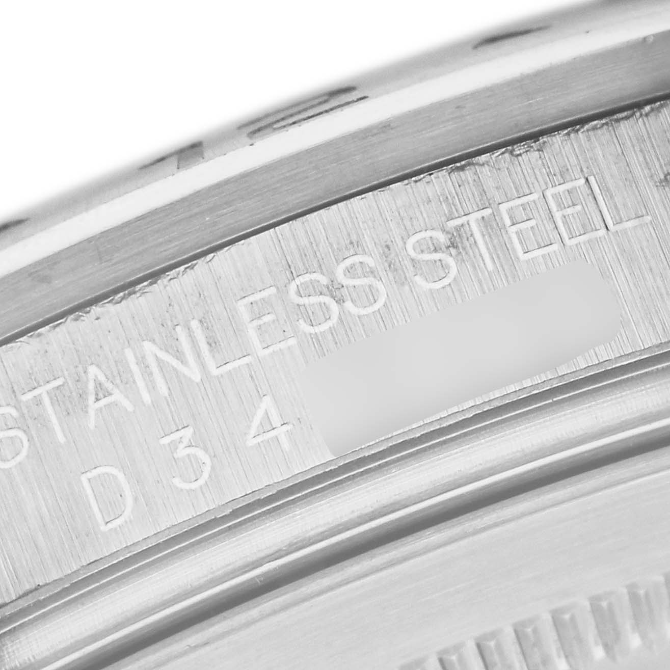 This image shows a close-up of the engraved stainless steel marking on the case back of a Rolex Explorer 16570 Men's Stainless Steel White Dial 16570 Men's Stainless Steel White Dial watch.