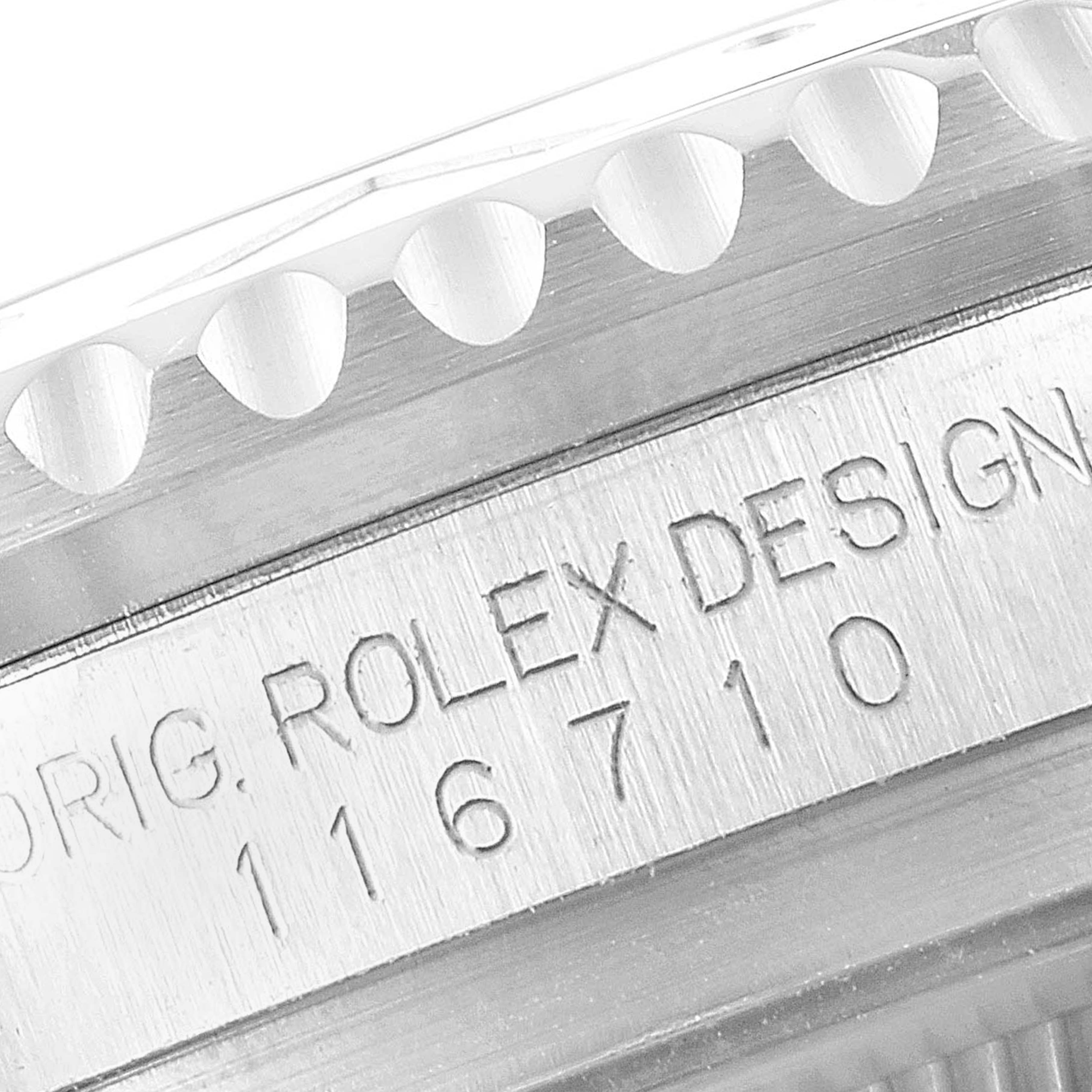 This image shows an angled close-up of the model number and bezel teeth of a Rolex GMT-Master 116710 Men
s Stainless Steel Black Dial 116710 Men
s Stainless Steel Black Dial watch.