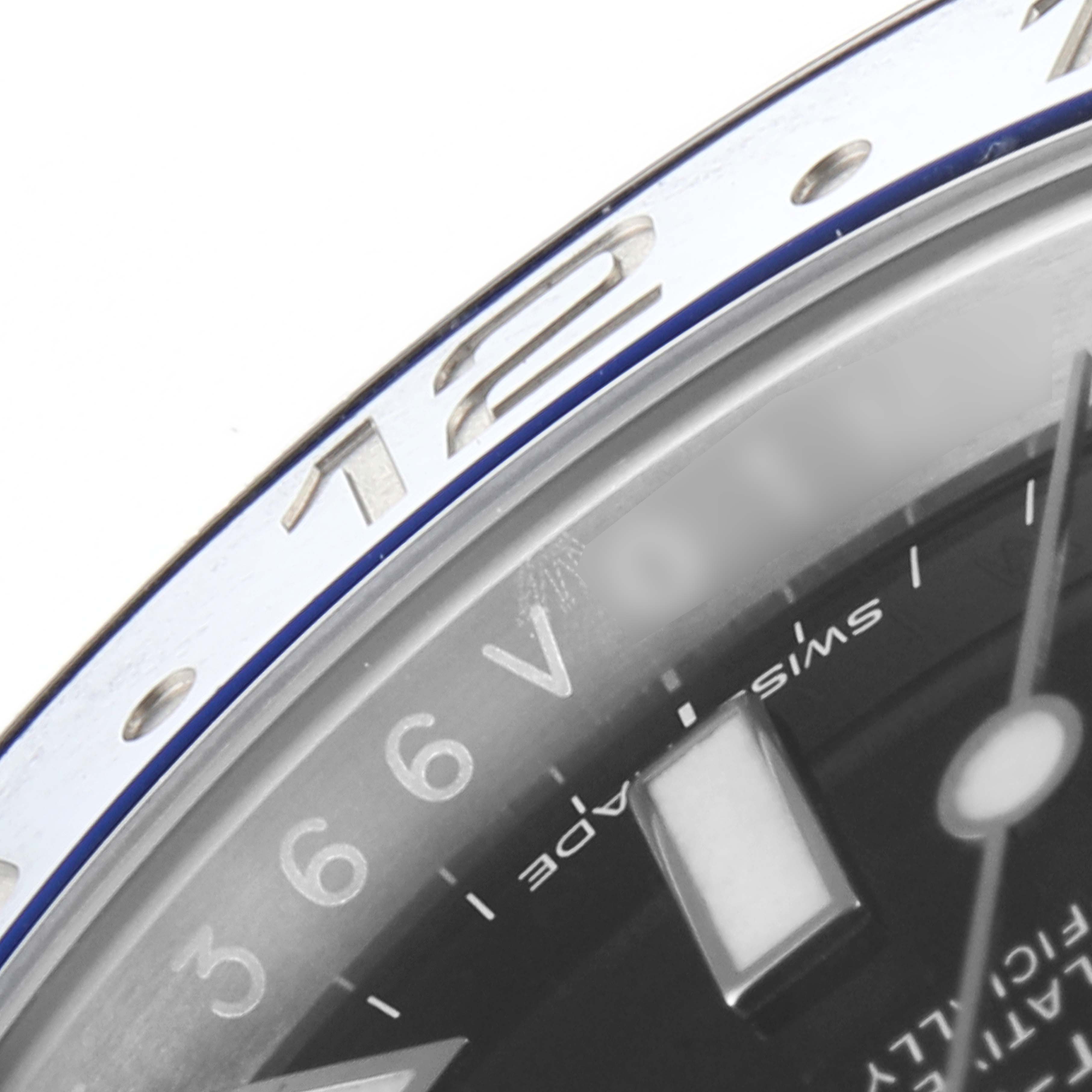 This close-up image shows the bezel and part of the dial of a Rolex GMT-Master 116710 Men
s Stainless Steel Black Dial 116710 Men
s Stainless Steel Black Dial watch.
