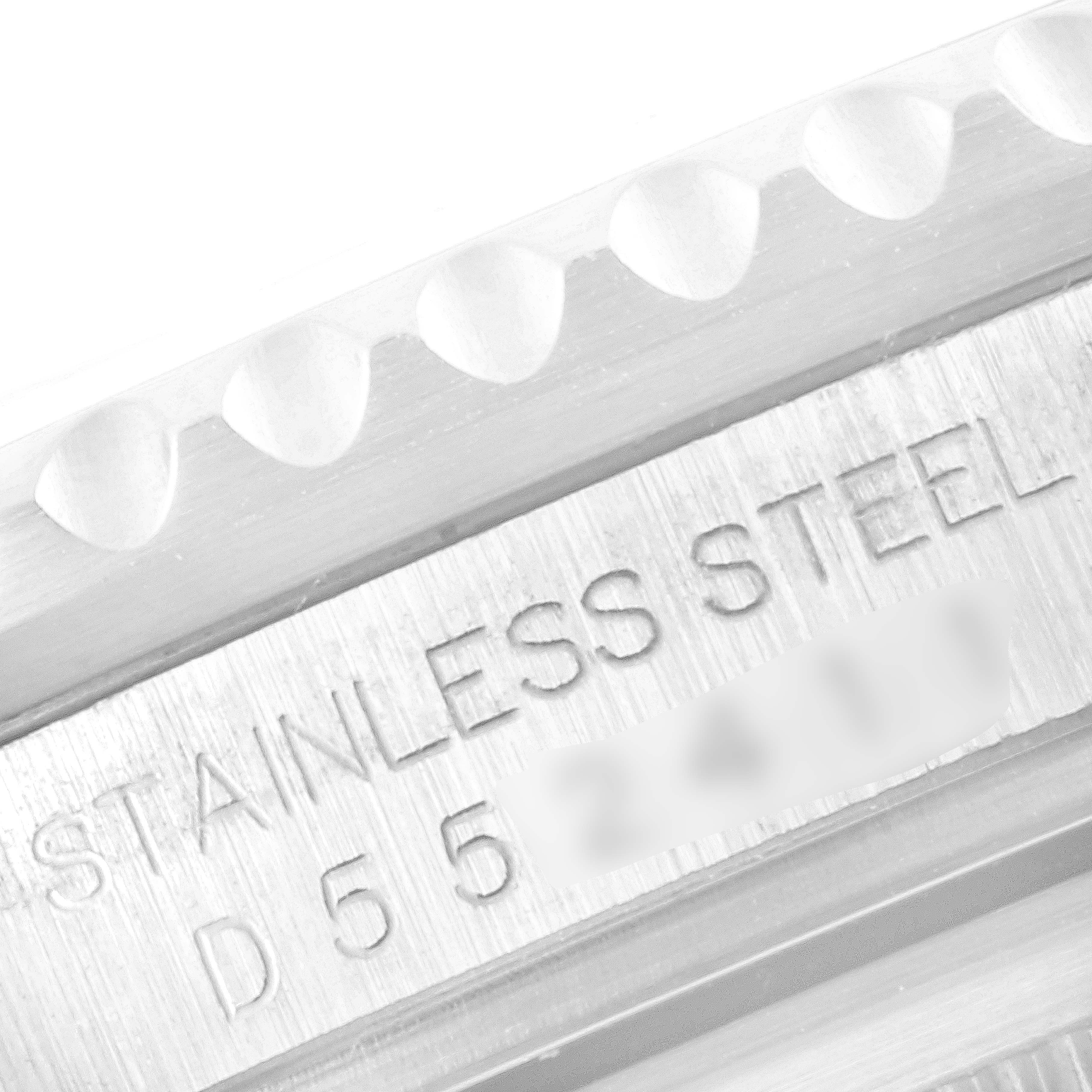 The image shows a close-up of the inner bezel and engraved serial number of a Rolex GMT-Master 16710 Men's Stainless Steel Black Dial 16710 Men's Stainless Steel Black Dial watch.