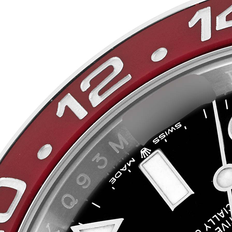 This image shows a close-up of the 12 o
clock position on the bezel and dial of a Rolex GMT-Master 126710 Men
s Stainless Steel Black Dial 126710 Men
s Stainless Steel Black Dial watch.