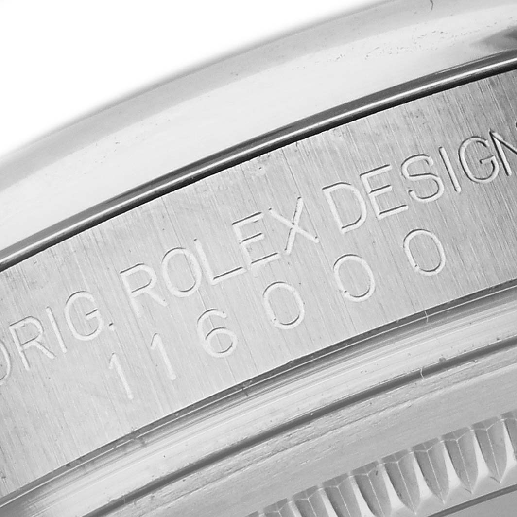 This image shows a close-up of the engraved case back wording and design details of the Rolex Oyster Perpetual 116000 Men's Stainless Steel Silver Dial 116000 Men's Stainless Steel Silver Dial watch.