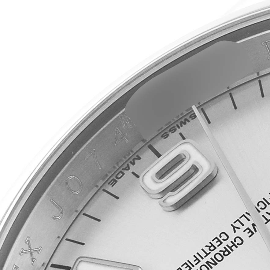 This close-up image shows the dial and a portion of the bezel of a Rolex Oyster Perpetual 116000 Men's Stainless Steel Silver Dial 116000 Men's Stainless Steel Silver Dial watch, highlighting the "Swiss Made" text.