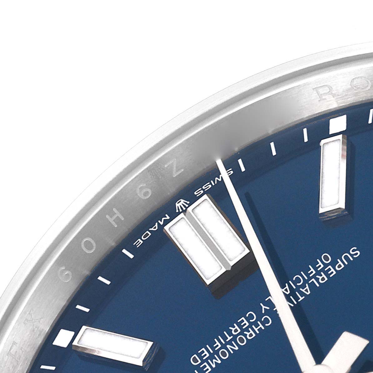This is a close-up of the dial and bezel of a Rolex Oyster Perpetual 124300 Men
s Stainless Steel Blue Dial 124300 Men
s Stainless Steel Blue Dial watch, showing the hour markers and part of the second hand.