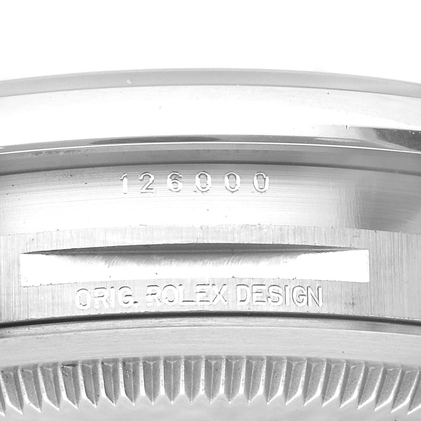 This image shows a close-up of the case back edge and engraved details of a Rolex Oyster Perpetual 126000 Men
s Stainless Steel Blue Dial 126000 Men
s Stainless Steel Blue Dial watch, specifically model 126000.