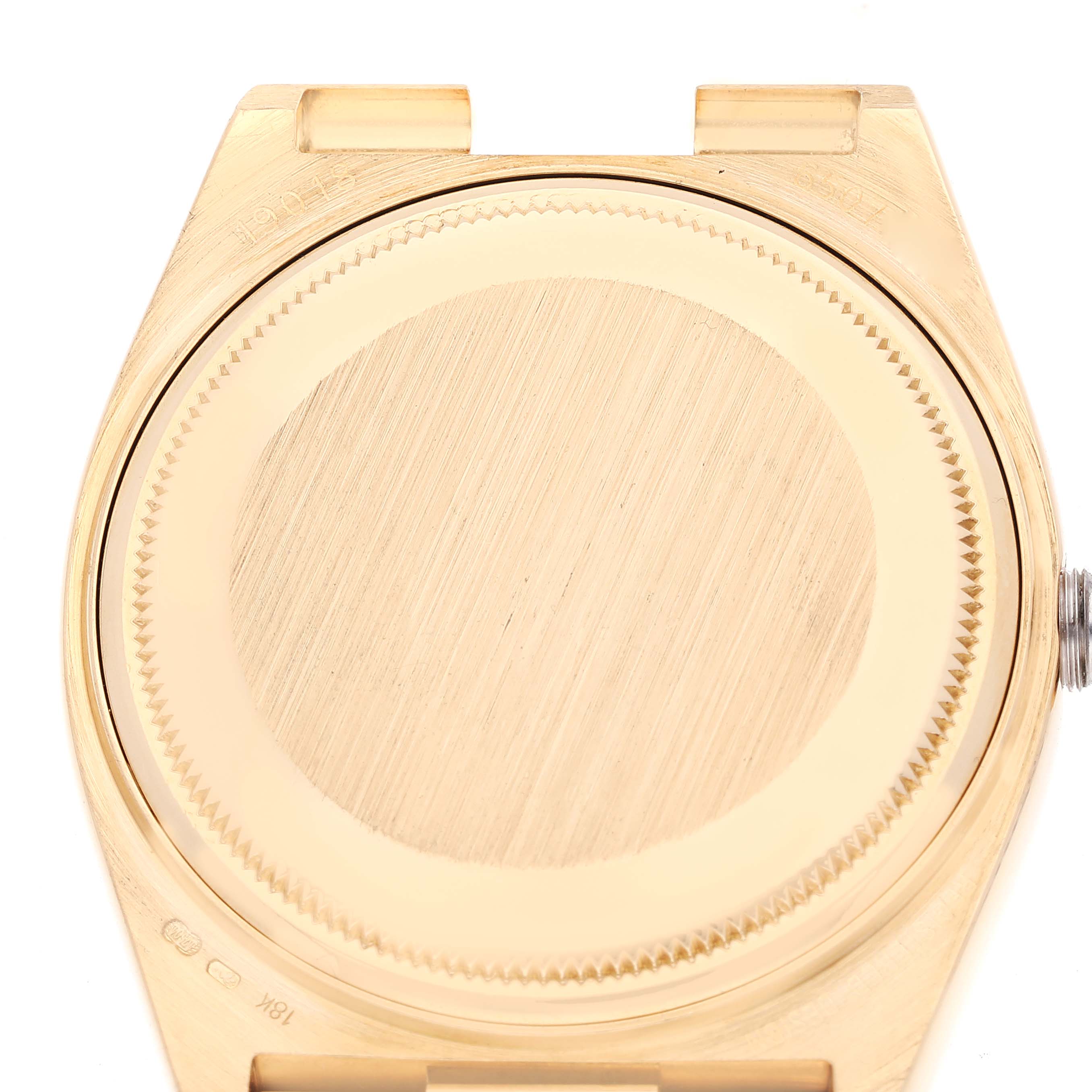 The image shows the case back of a Rolex President 19018 Men's Yellow Gold Black Dial 19018 Men's Yellow Gold Black Dial model watch taken from a top-down angle.