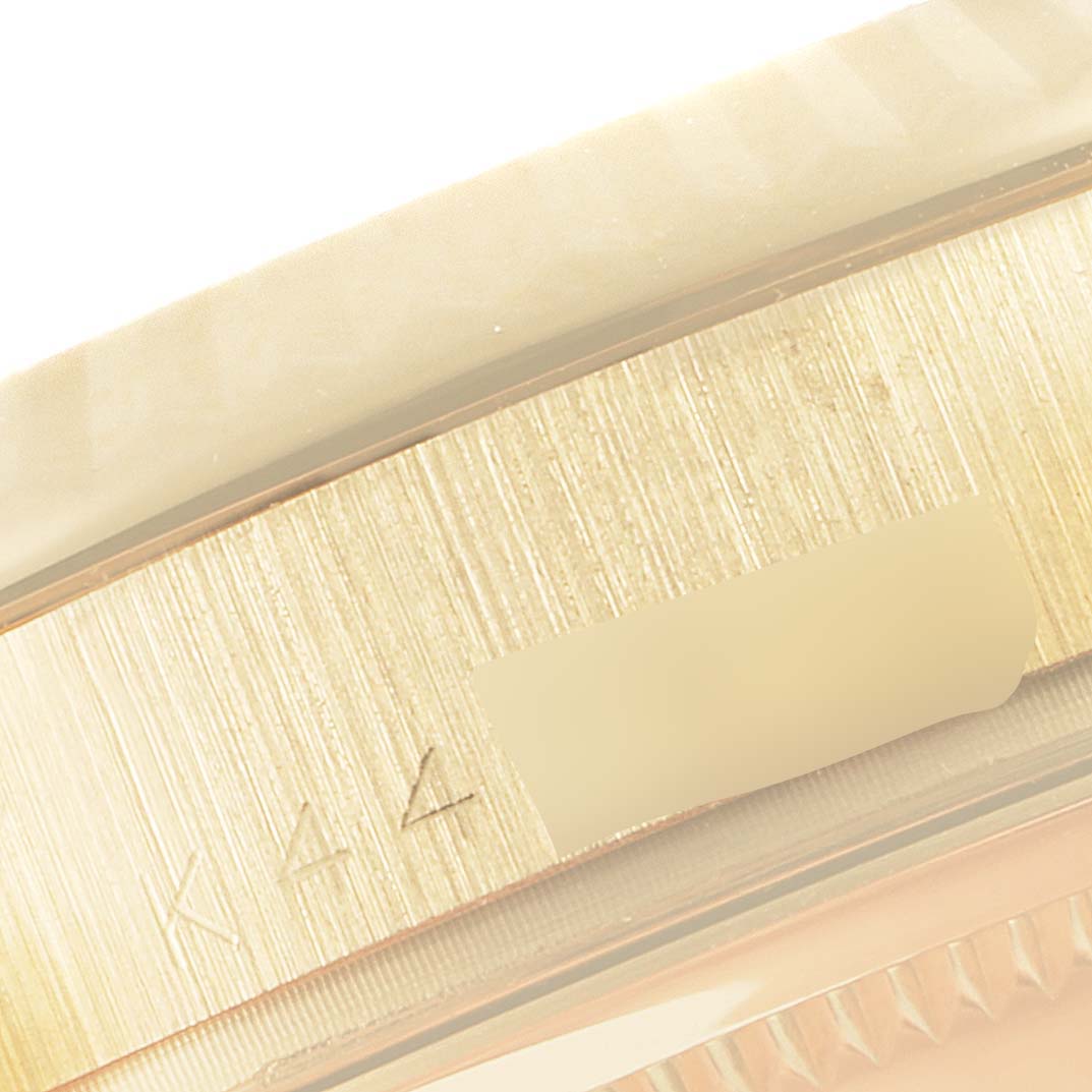 This close-up angle shows part of the bezel and case of the President model by Rolex.