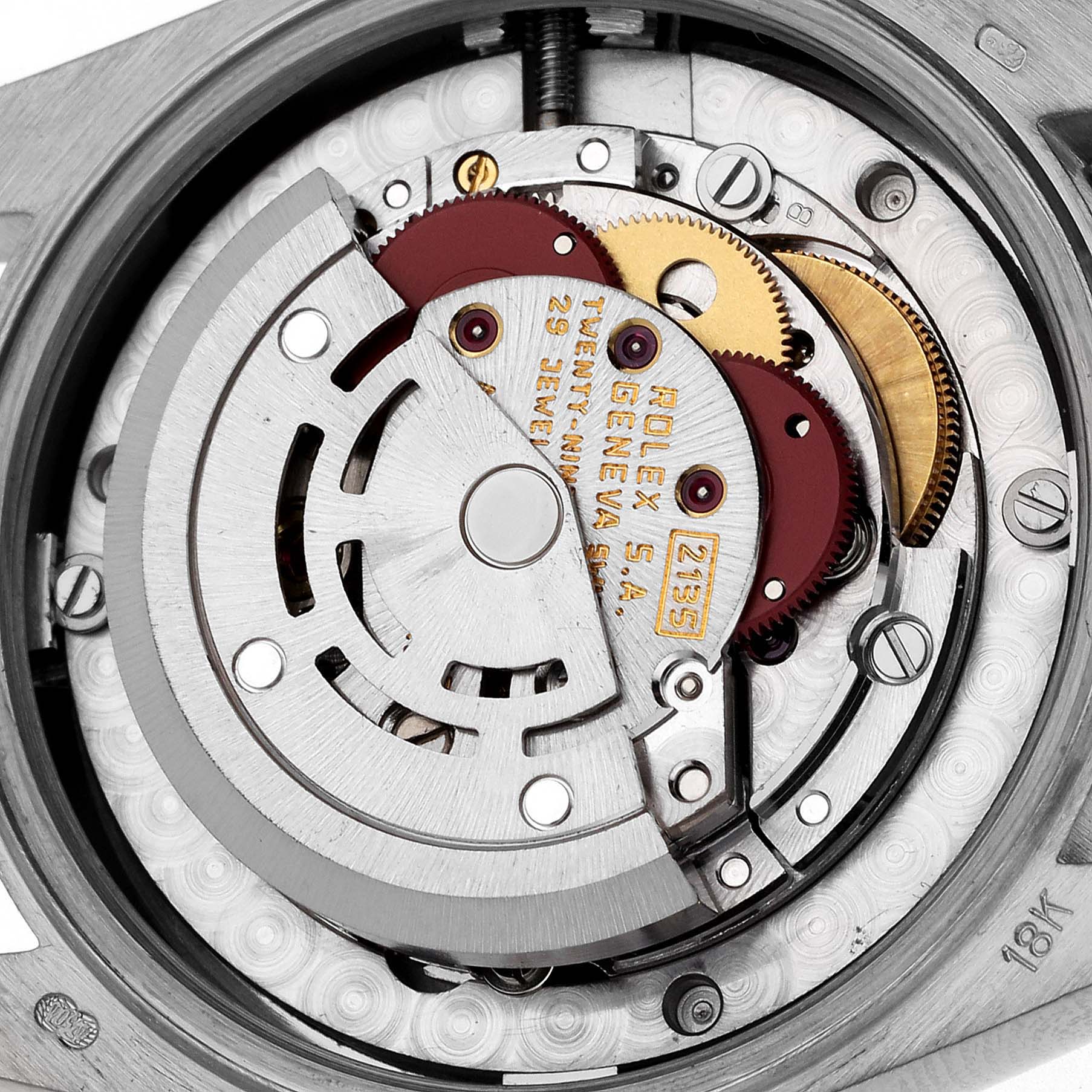 The image shows a close-up of the Rolex President 68149 Women's White Gold Champagne Dial 68149 Women's White Gold Champagne Dial model's movement, highlighting gears and the rotor.