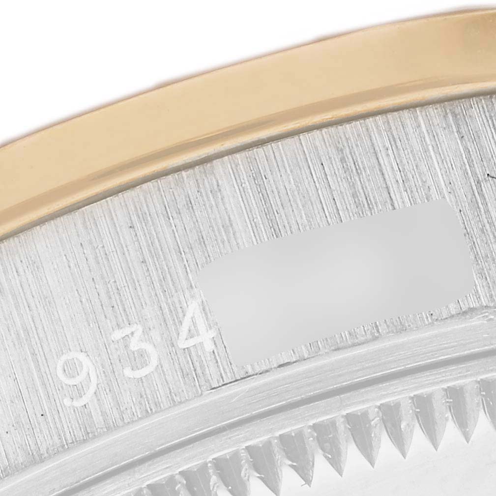 The image shows a close-up of the case and part of the bezel of a Rolex President 68149 Women's White Gold Champagne Dial 68149 Women's White Gold Champagne Dial watch, highlighting the serial engraving.