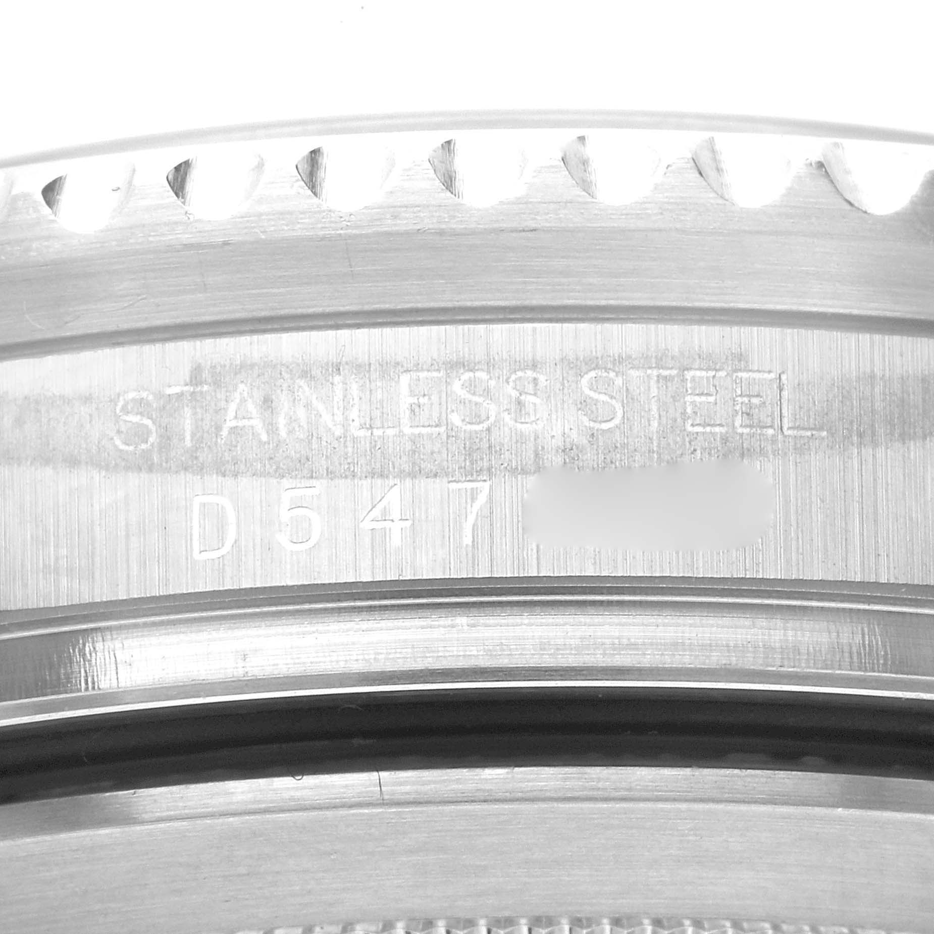 The image shows a close-up of the caseback engravings on a Rolex Sea-Dweller 16600 Men's Stainless Steel Black Dial 16600 Men's Stainless Steel Black Dial watch, displaying "STAINLESS STEEL" and a partial serial number.