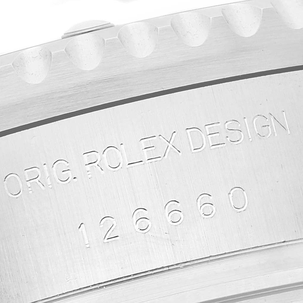 The image shows a close-up angle of the Rolex Sea-Dweller 126660 Men
s Stainless Steel Blue Dial 126660 Men
s Stainless Steel Blue Dial
s case side, focusing on the engraving "ORIG. ROLEX DESIGN 126660".