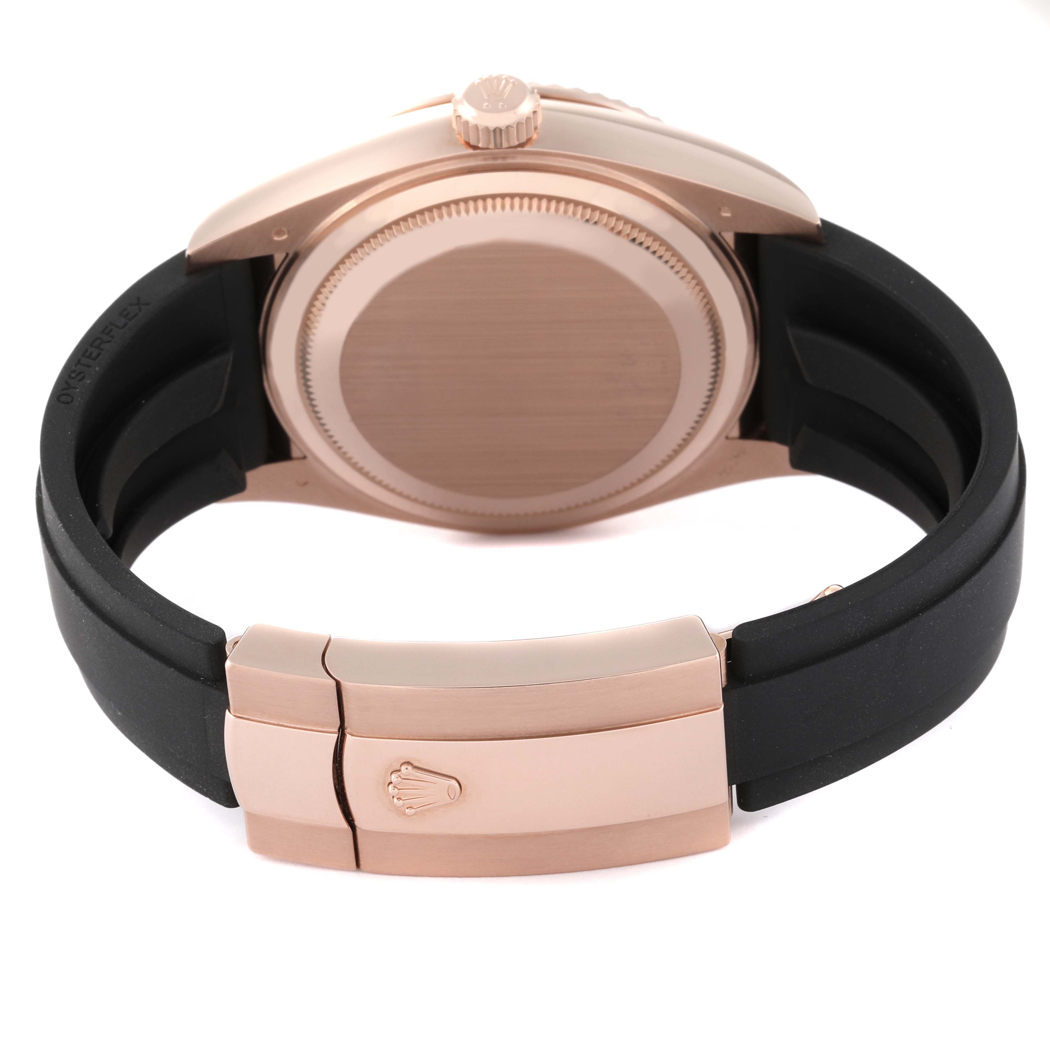 The image shows the back and clasp of a Rolex Sky-Dweller 326235 Men's Rose Gold White Dial 326235 Men's Rose Gold White Dial with a black strap and rose gold case and buckle.