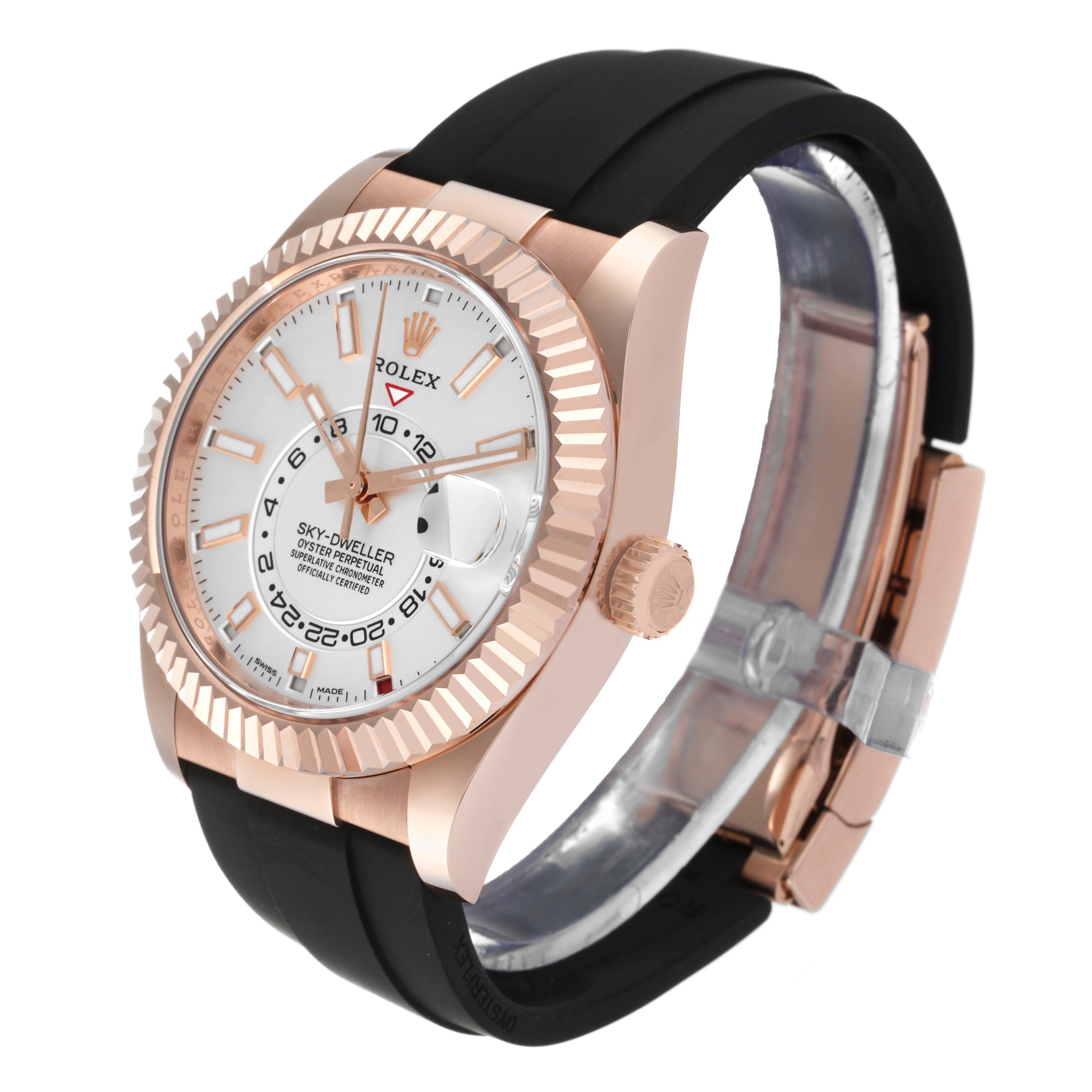 The Rolex Sky-Dweller 326235 Men's Rose Gold White Dial 326235 Men's Rose Gold White Dial watch is shown at an angle highlighting its face, bezel, and black strap.