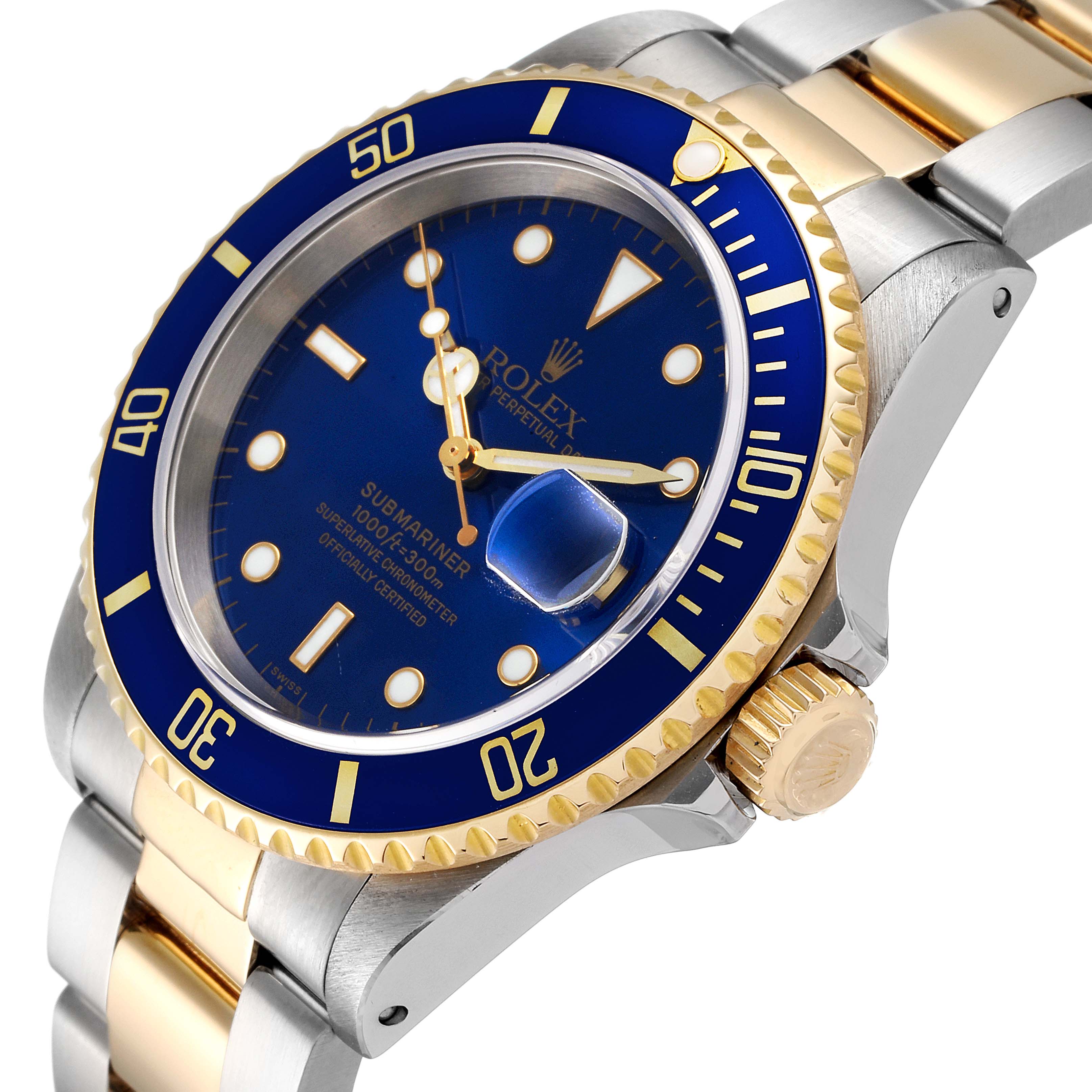 The image shows a Rolex Submariner 16613 Men's Steel and Gold (two tone) Blue Dial 16613 Men's Steel and Gold (two tone) Blue Dial watch from an angled perspective, highlighting the blue dial, bezel, and gold and silver bracelet.