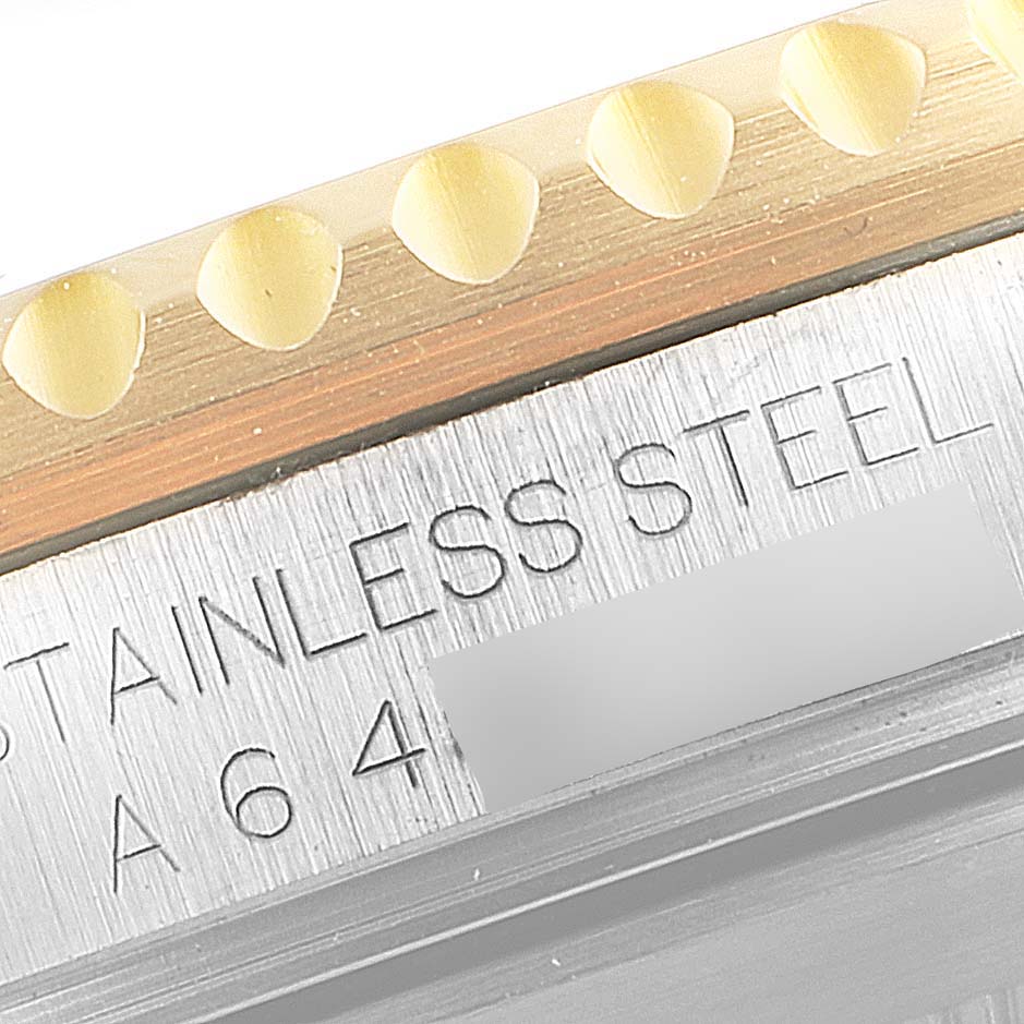 This close-up image shows a partial view of the stainless steel bezel and case of the Rolex Submariner 16613 Men's Steel and Gold (two tone) Blue Dial 16613 Men's Steel and Gold (two tone) Blue Dial model.