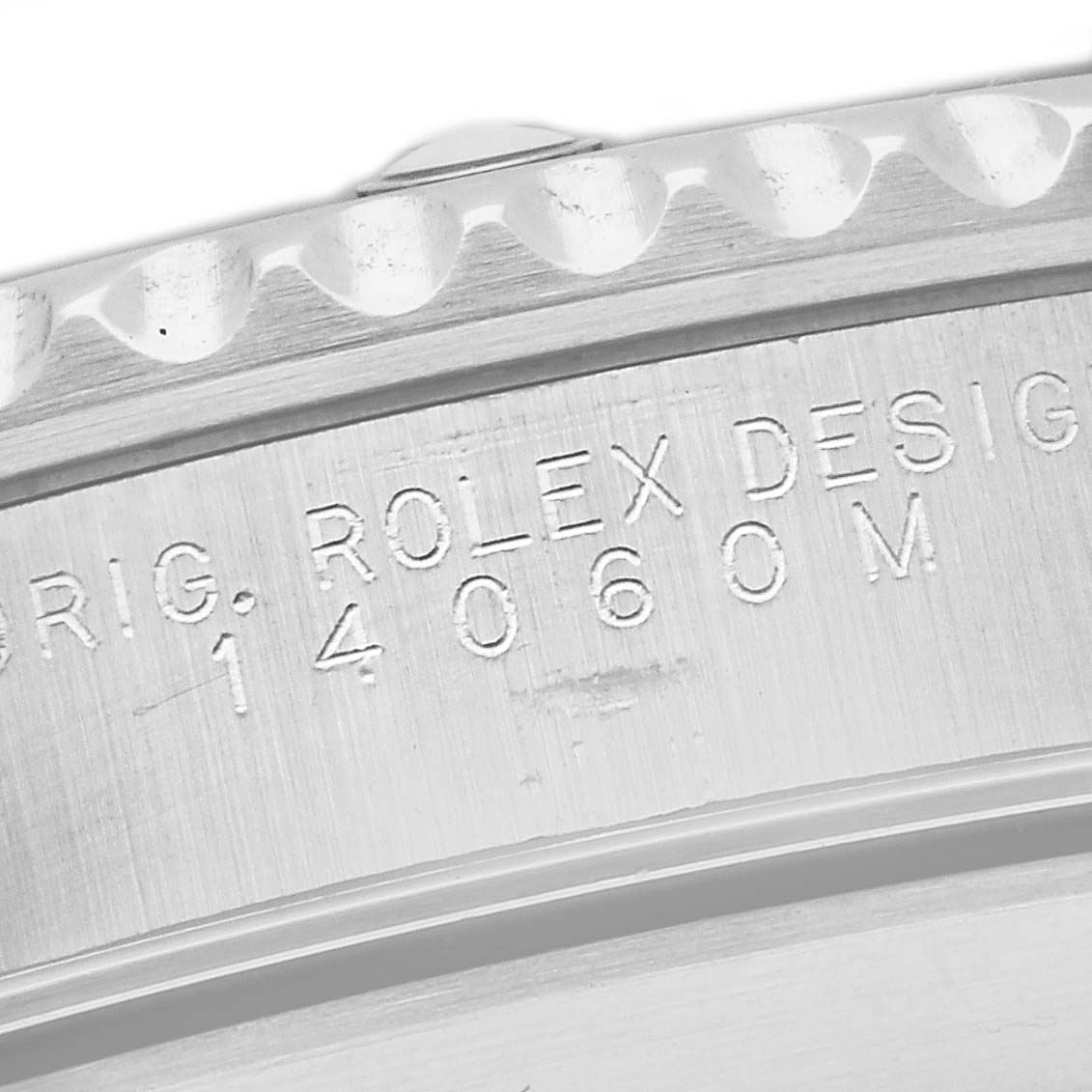 This image shows a close-up of the engraved case side of a Rolex Submariner 14060 Men
s Stainless Steel Black Dial 14060 Men
s Stainless Steel Black Dial watch, highlighting its model number.