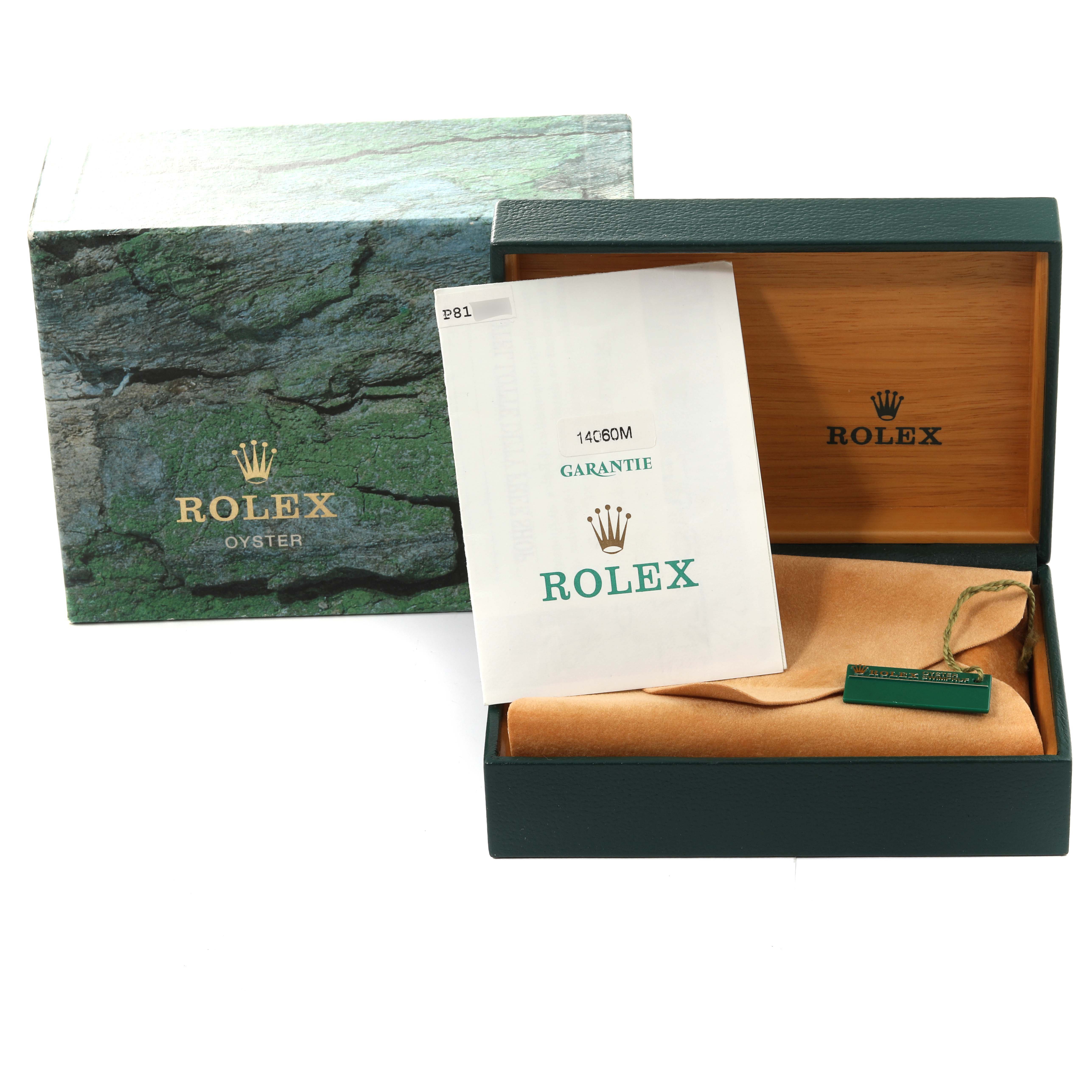 The image shows a Rolex Submariner 14060 Men
s Stainless Steel Black Dial 14060 Men
s Stainless Steel Black Dial box, instruction manual, and warranty card, viewed from a frontal angle.