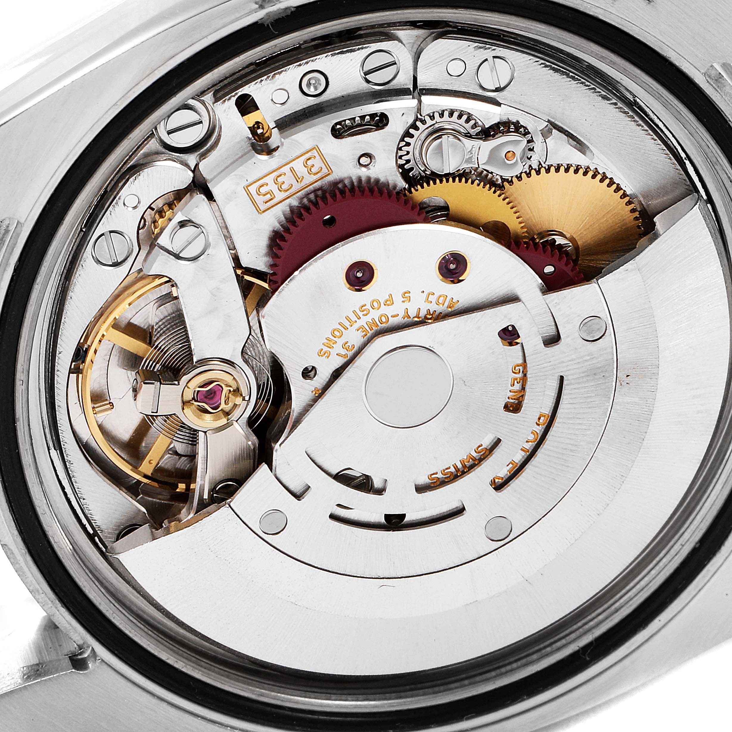 This image shows the internal mechanism of a Rolex Turn-o-Graph 116263 Men
s Steel and Gold (two tone) Grey Dial 116263 Men
s Steel and Gold (two tone) Grey Dial watch from a close-up, showcasing its intricate gears and components.