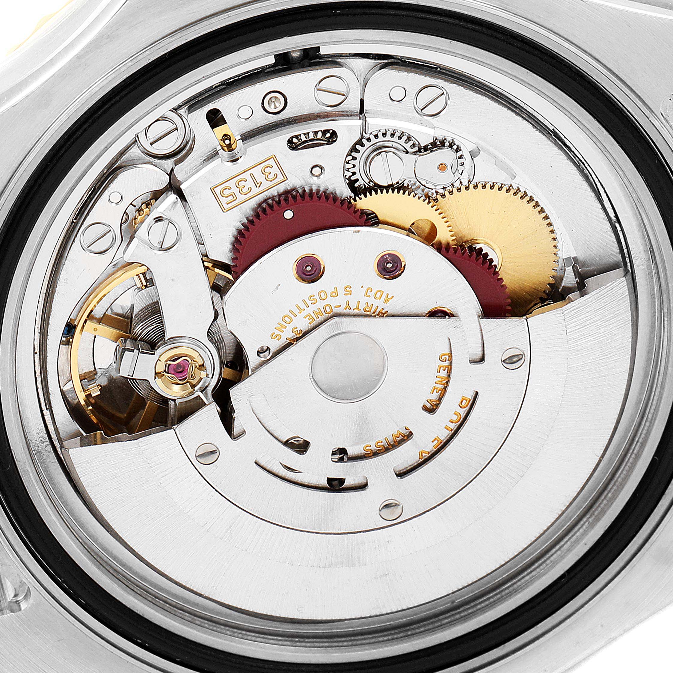 The image shows the inner mechanism of a Rolex Yacht-Master 16623 Men
s Steel and Gold (two tone) White Dial 16623 Men
s Steel and Gold (two tone) White Dial watch from a close-up angle.