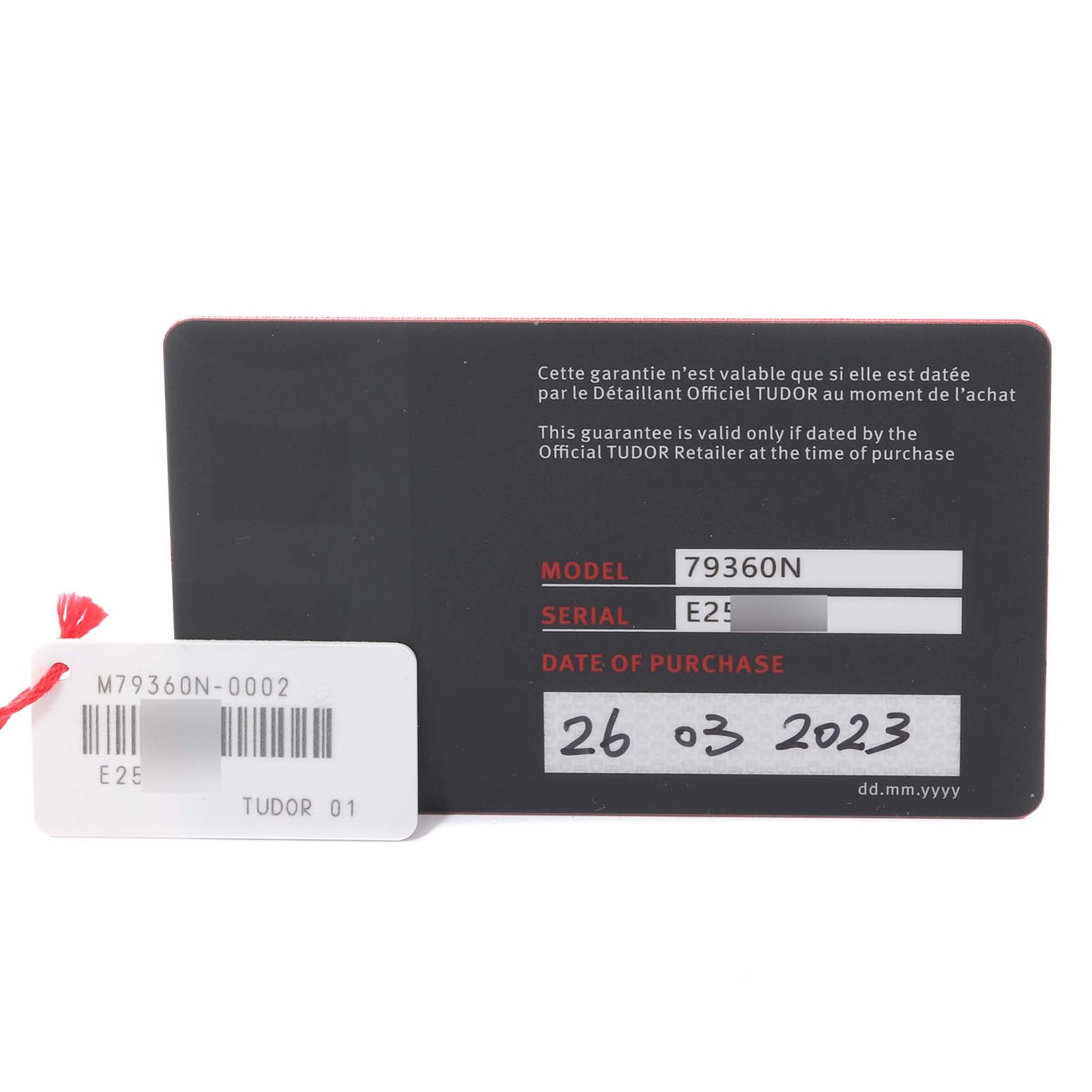 This image shows a warranty card for the Tudor Heritage Black Bay model 79360N with purchase date and serial number.