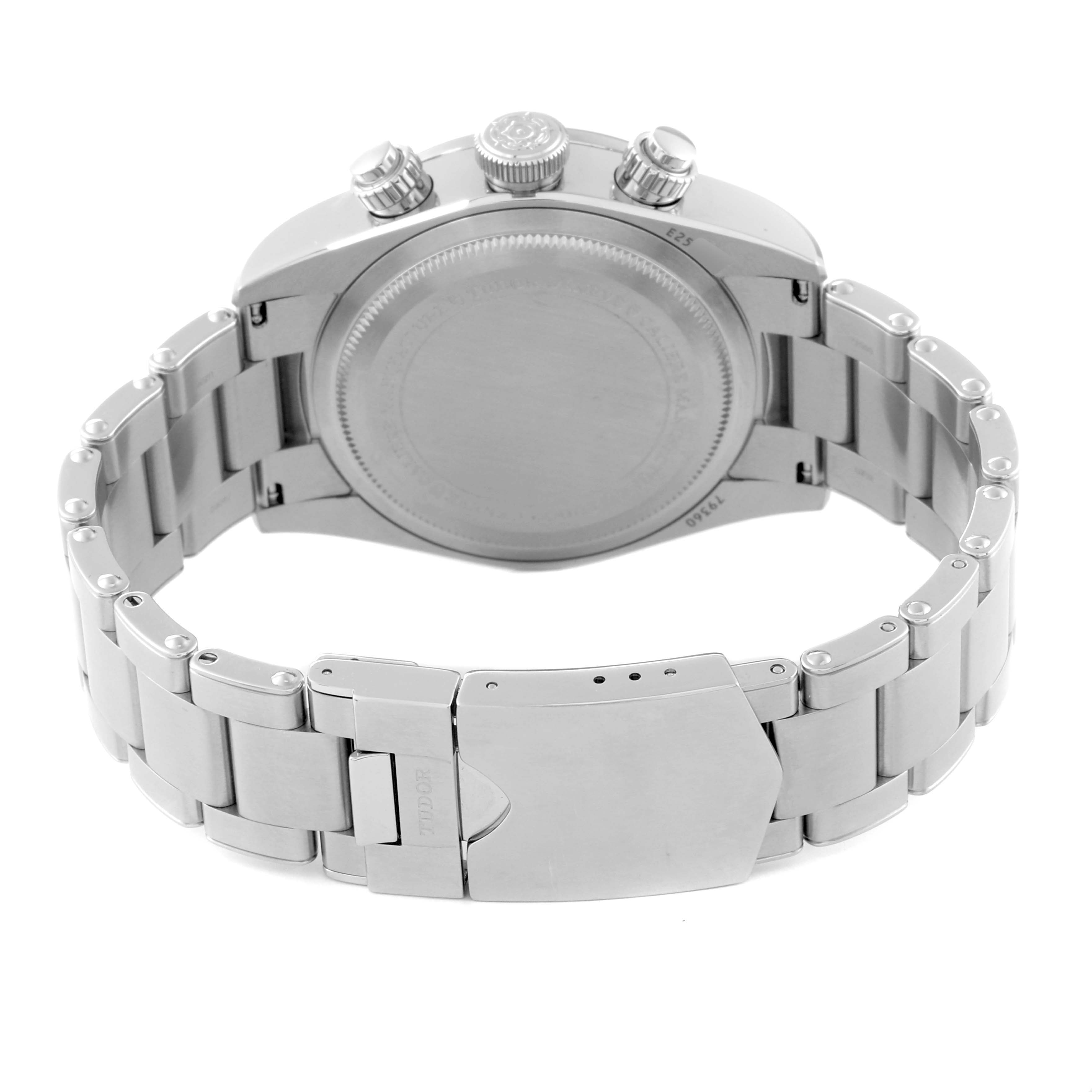 The image shows the back case, crown, and deployment clasp of a Tudor Heritage Black Bay watch from a rear angle.