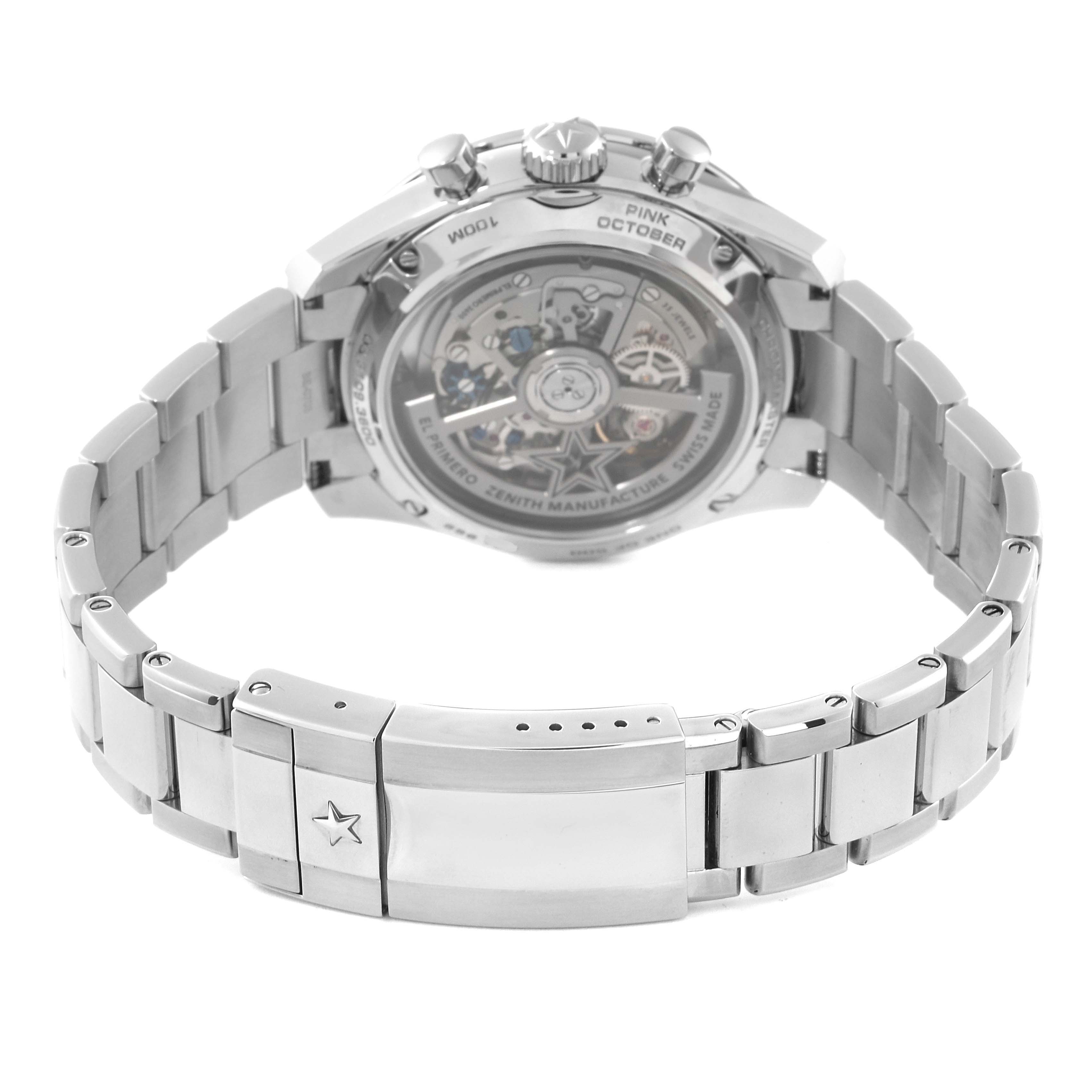 The image shows the back view of a Zenith El Primero watch, highlighting its movement and stainless steel bracelet.