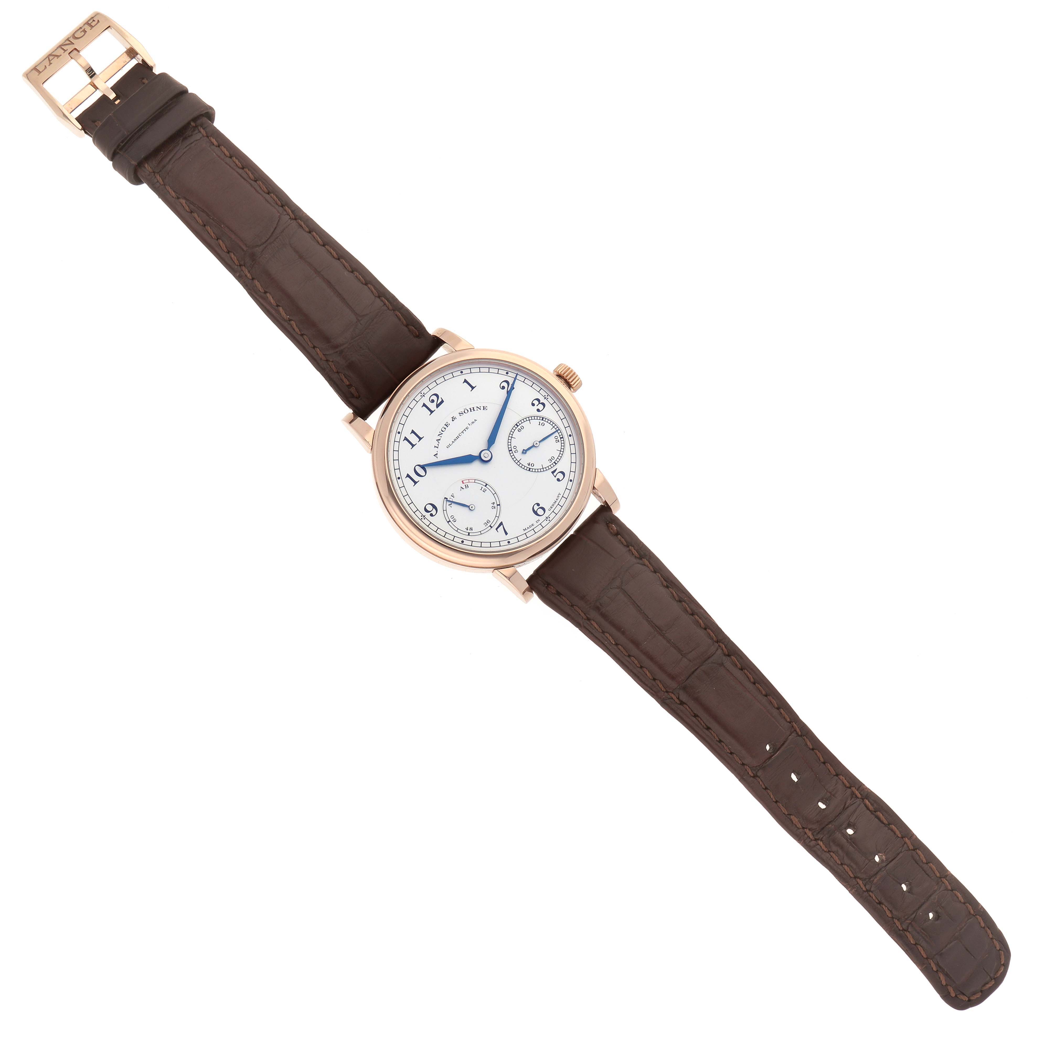 The A. Lange 
Sohne 1815 234.032 Men
s Rose Gold Silver Dial watch is shown from a top-down angle, with a brown leather strap and a white dial featuring blue hands.