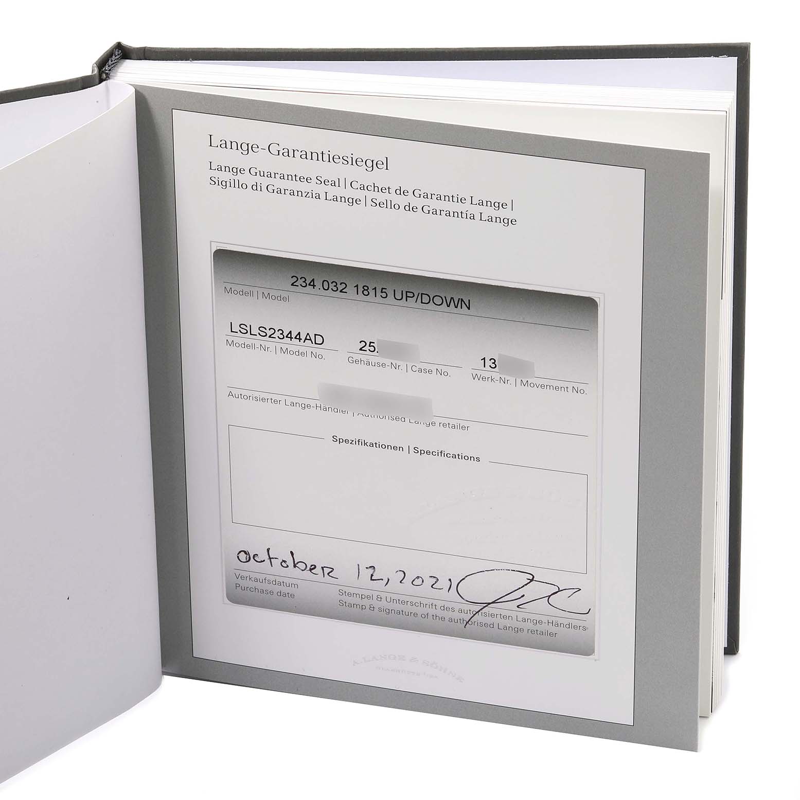 This image shows the guarantee certificate for the A. Lange 
Sohne 1815 234.032 Men
s Rose Gold Silver Dial model watch inside an open book or folder.