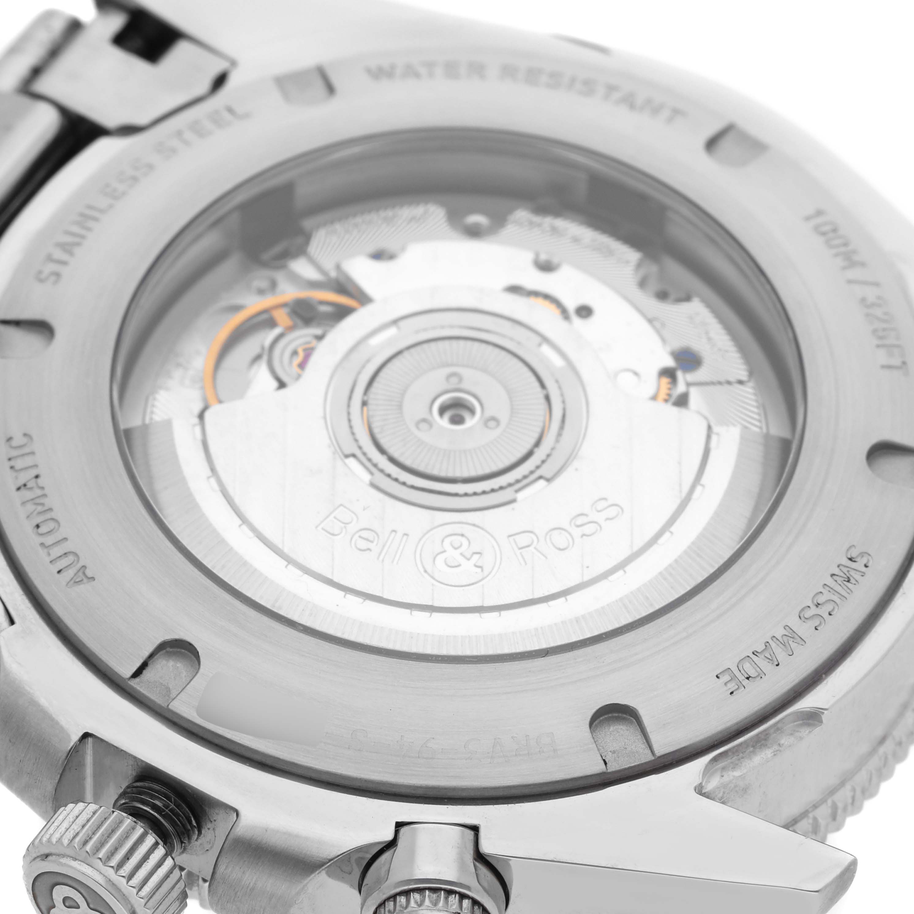 The image shows the back case of the Bell 
Ross Heritage BRV394-BL-ST/SST Men
s Stainless Steel Black Dial BRV394-BL-ST/SST Men
s Stainless Steel Black Dial model watch, revealing its automatic movement and inscriptions.