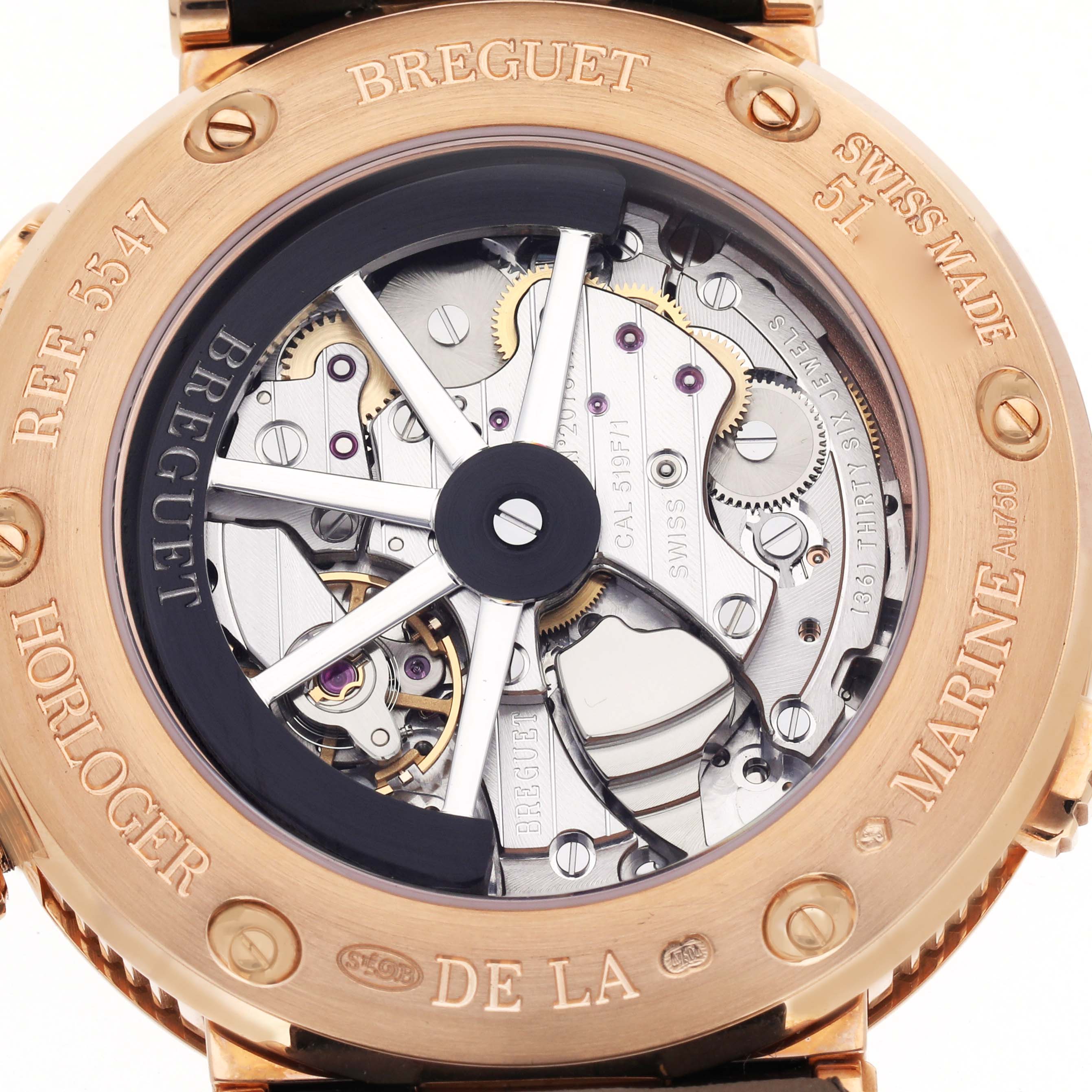 The image shows the back view of the Breguet Marine 5547 Men
s Rose Gold Silver Dial watch, revealing its intricate movement and inner mechanics.