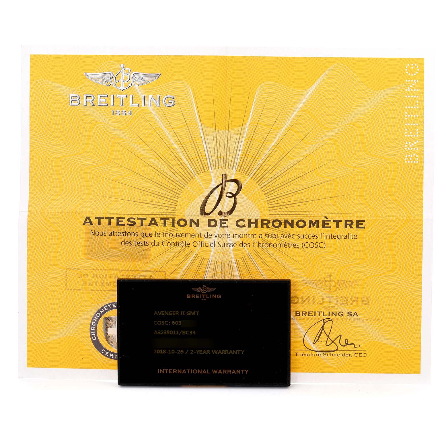 The image shows a Breitling Avenger A32390 Men
s Stainless Steel Black Dial model
s certification and international warranty card.