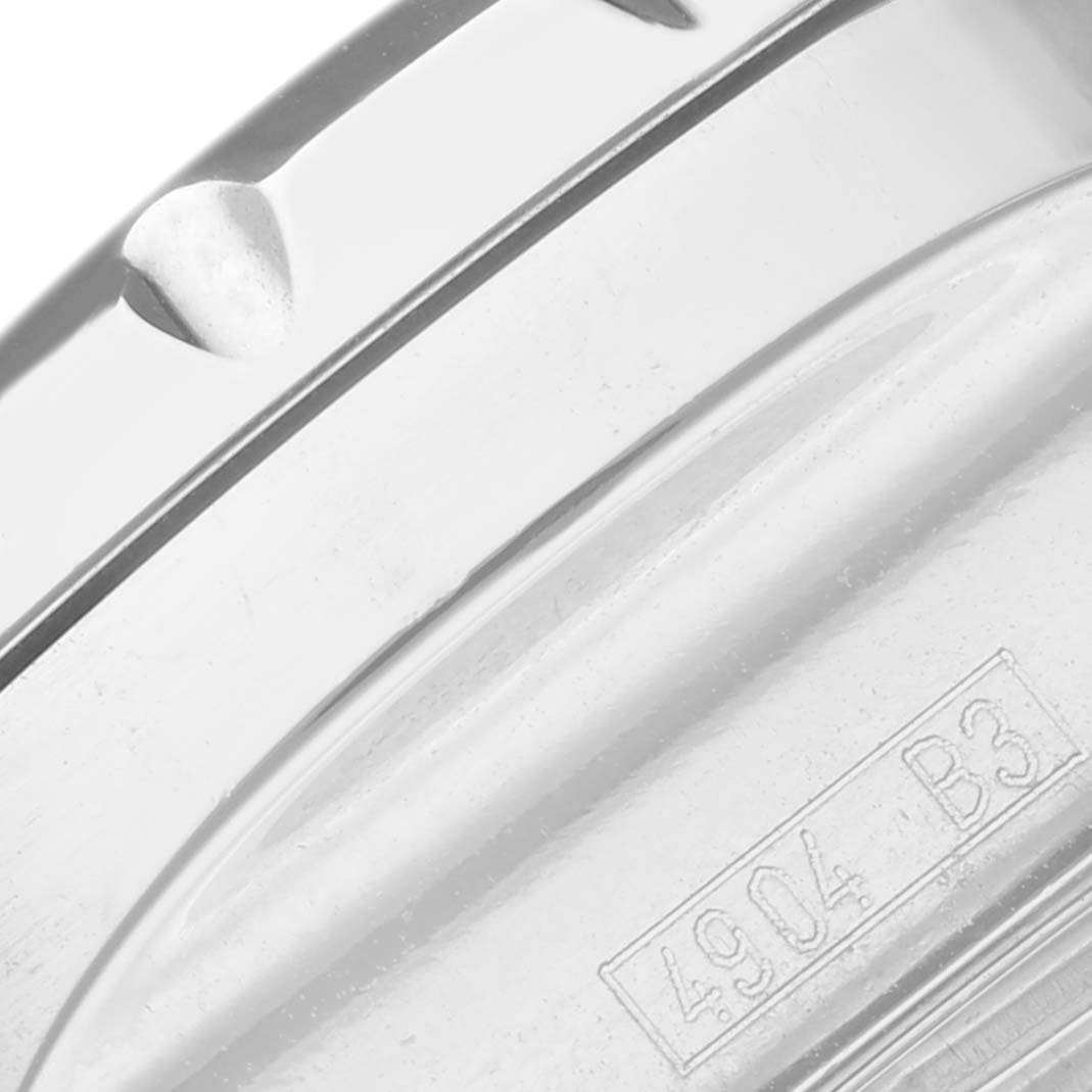 This close-up image shows the side of the case of a Breitling Bentley A13362 Men's Stainless Steel White Dial A13362 Men's Stainless Steel White Dial watch with the engraving "4904 B3."