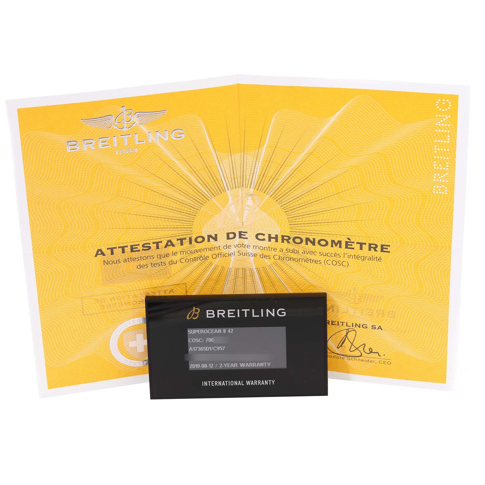 The image shows the warranty card and certificate for the Breitling Superocean A17365 Men
s Stainless Steel Blue Dial A17365 Men
s Stainless Steel Blue Dial watch, with both documents laid flat.