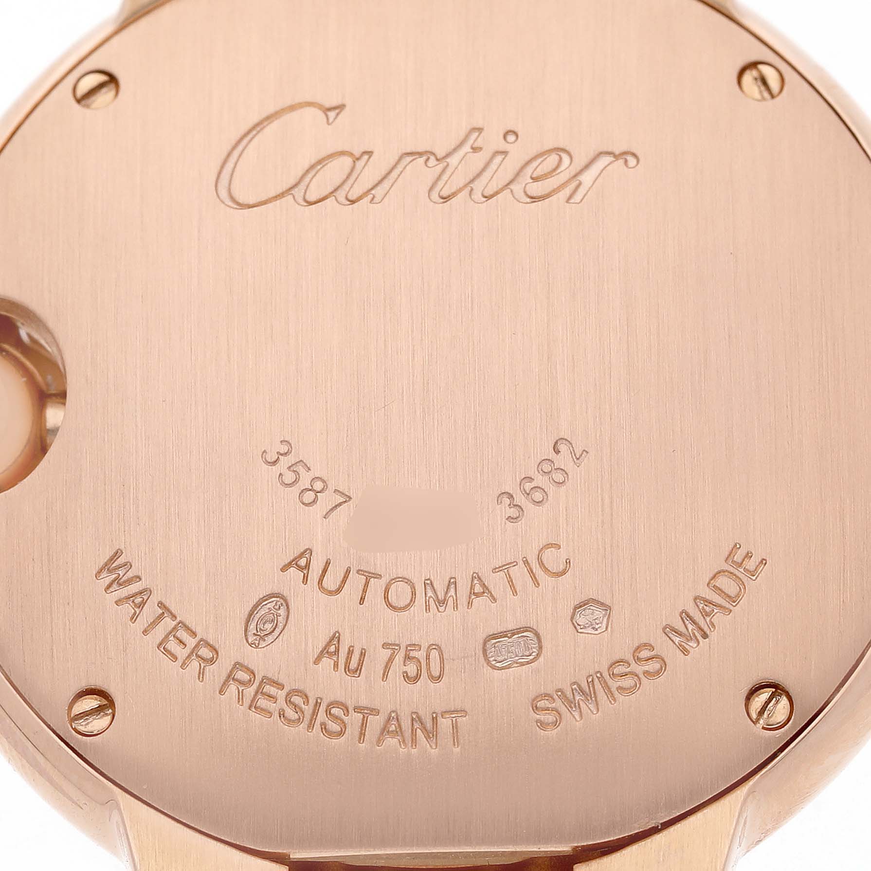 The image shows the back of a Cartier Ballon Bleu WJBB0036 Women's Rose Gold Silver Dial watch, highlighting engravings and screws.