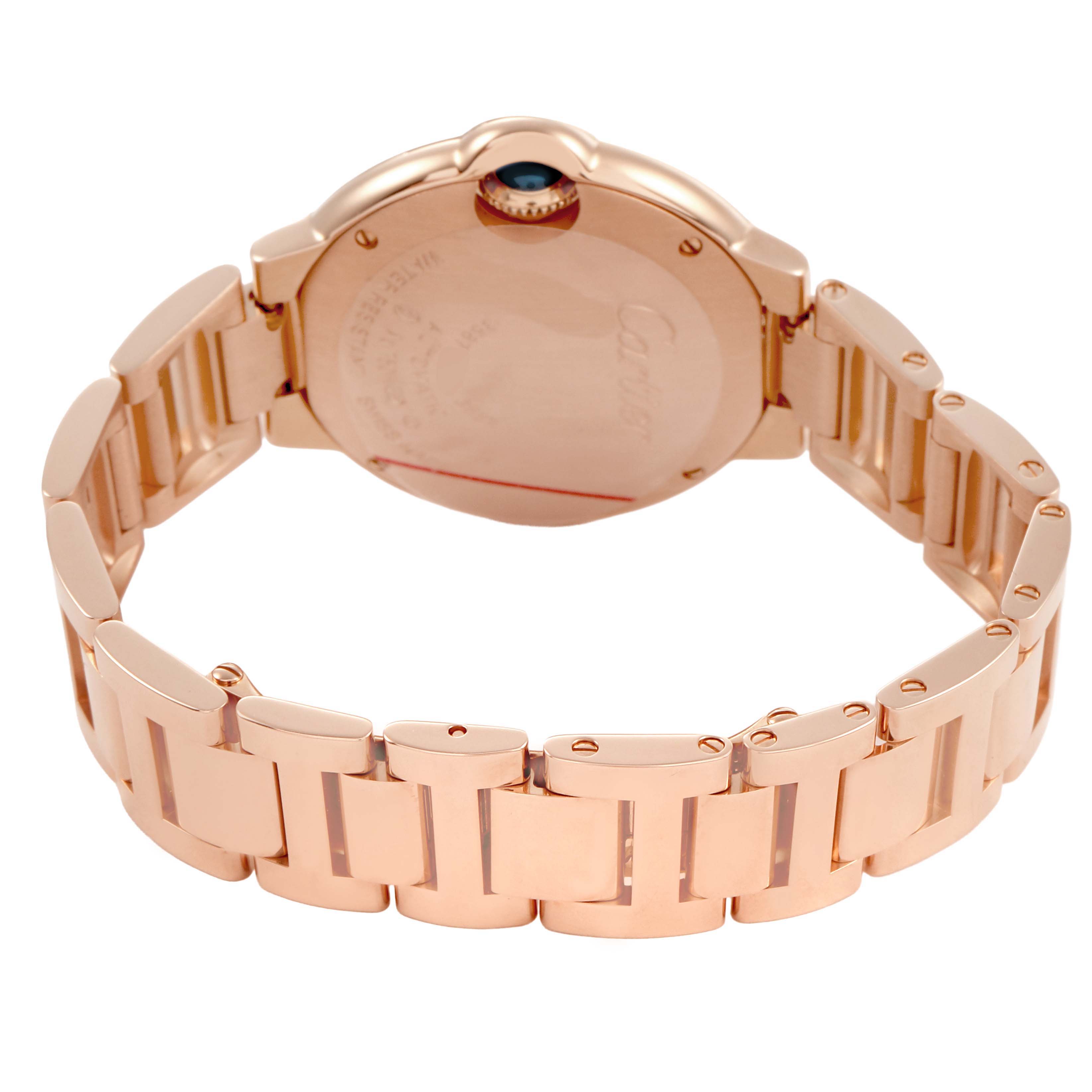 The Cartier Ballon Bleu WJBB0036 Women's Rose Gold Silver Dial watch is shown from the back, highlighting the bracelet and the case's rear.