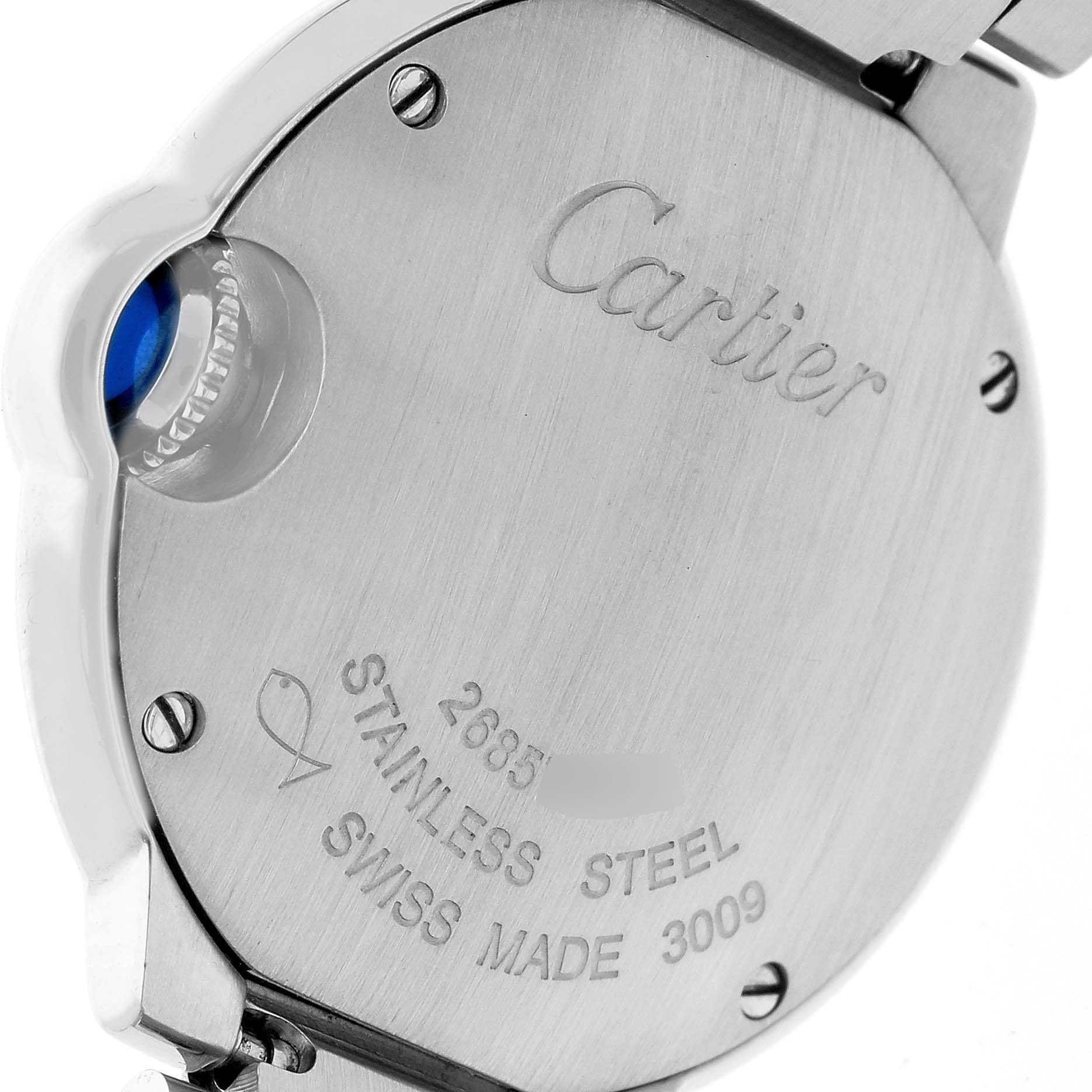The image shows the back of a Ballon Bleu de Cartier watch, including the screws, engravings, and part of the winding crown.