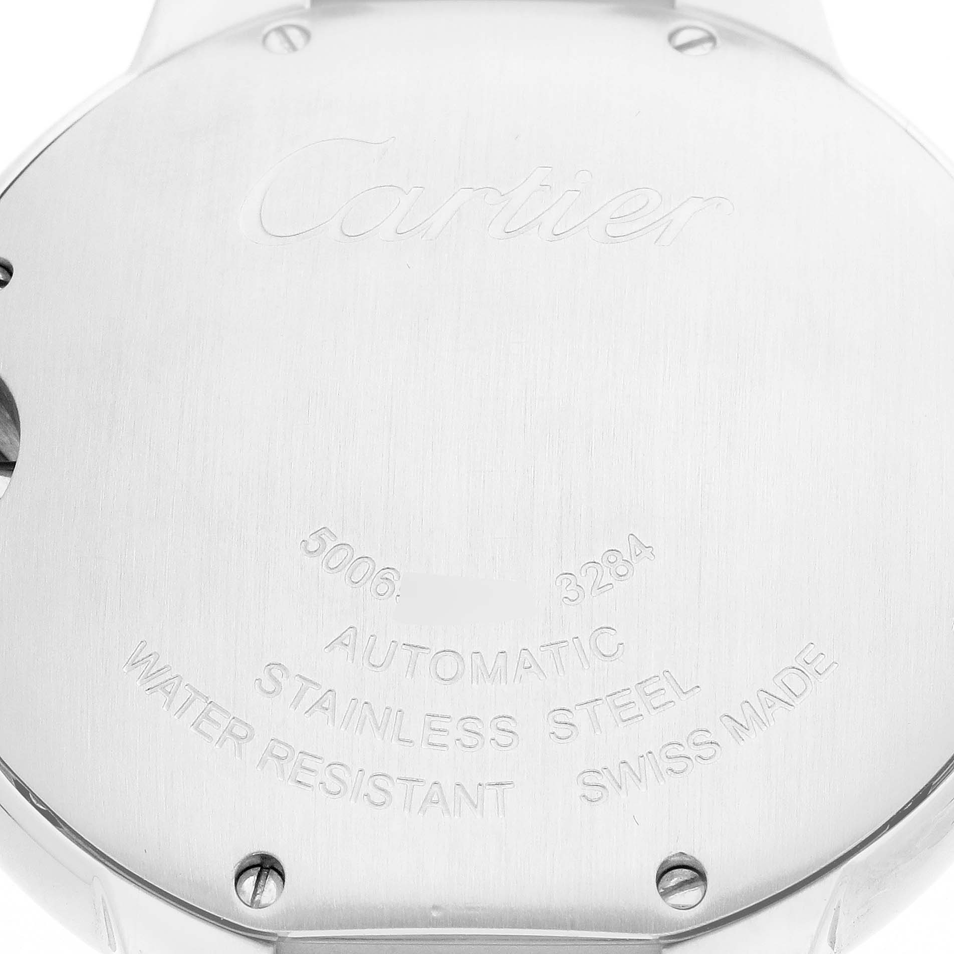 The image shows the back case of a Cartier Ballon Bleu W6920033 Women
s Stainless Steel Mother of Pearl Dial watch, highlighting engraved details and screws.