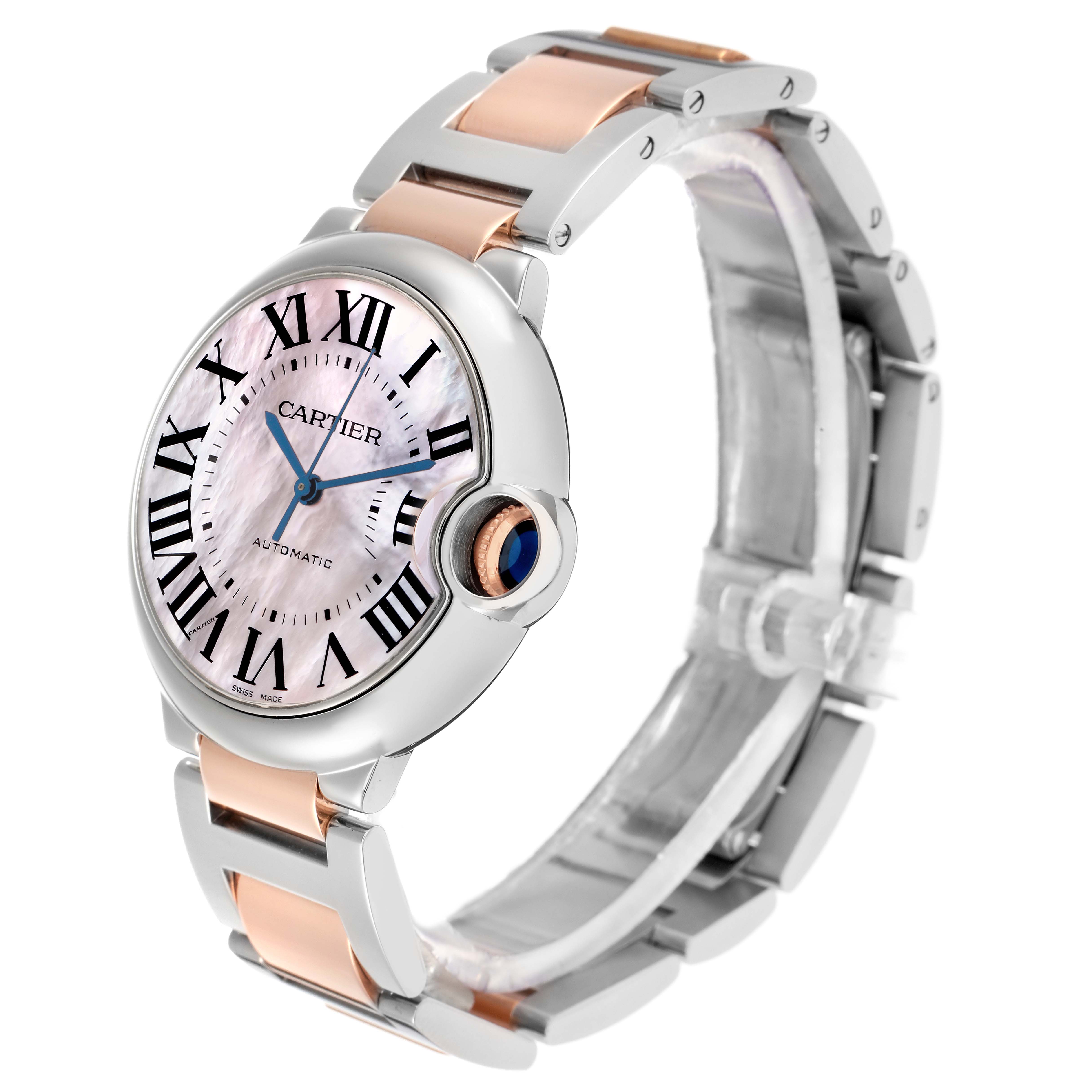 The Cartier Ballon Bleu W6920033 Women
s Stainless Steel Mother of Pearl Dial watch is shown at an angle highlighting the face, crown, and bracelet with a focus on the dial and its markings.