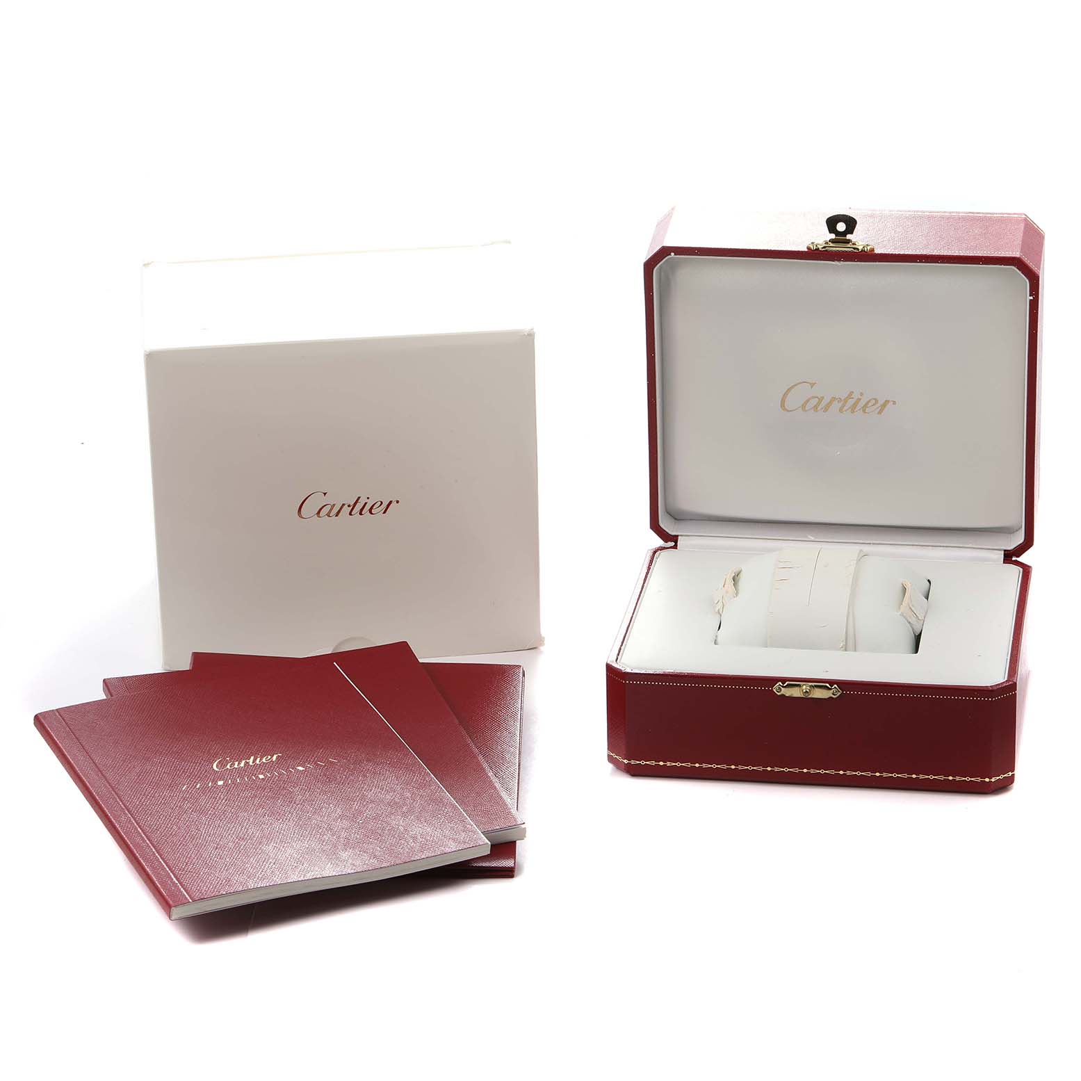 The image shows an open Cartier box for the Calibre de Cartier model along with documentation and outer packaging.