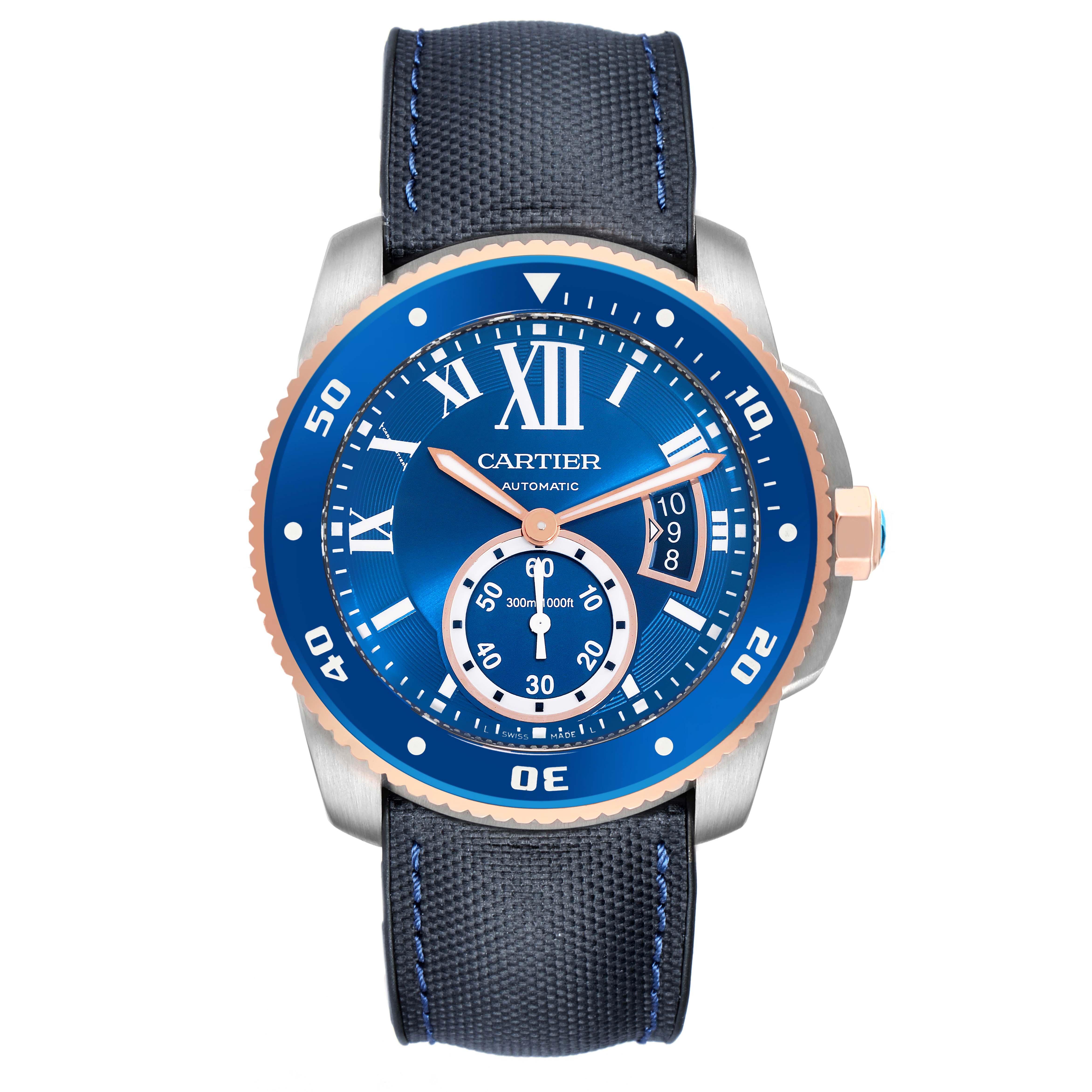 The Calibre de Cartier watch is shown from a front angle, displaying its blue dial, bezel, and strap.