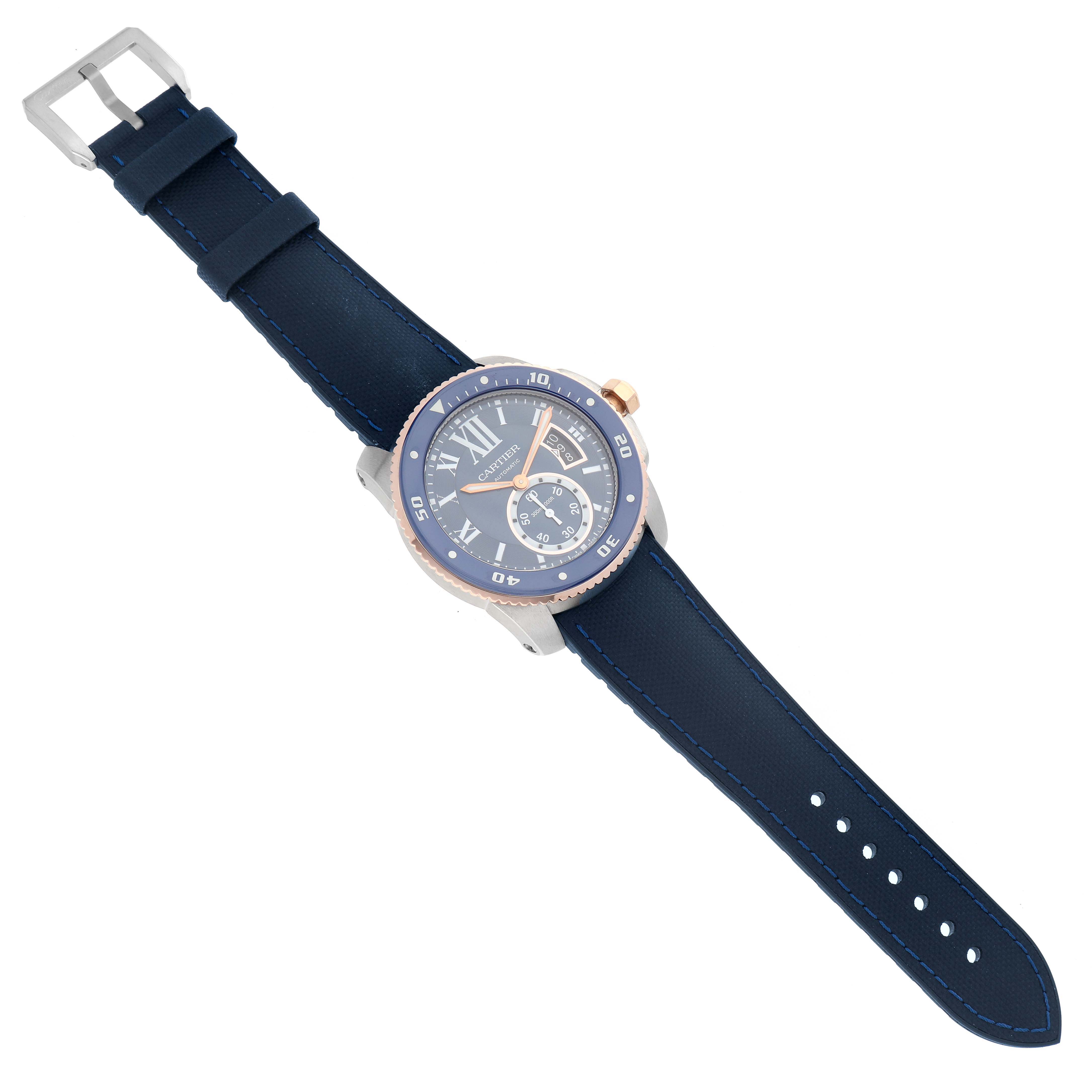 The Calibre de Cartier watch by Cartier is shown at an angled top view, displaying the face, bezel, crown, and strap.