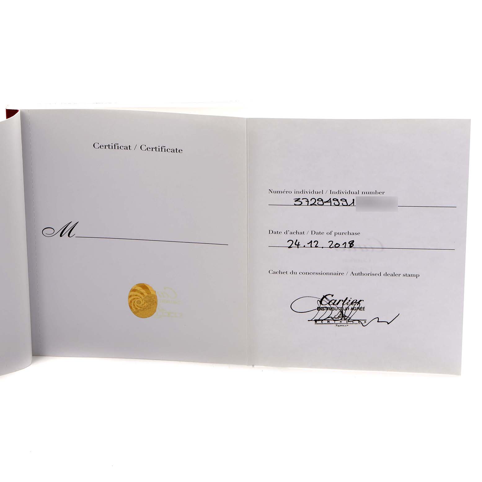 The image shows an open certificate book for a Calibre de Cartier watch by Cartier, displaying an individual number, purchase date, and dealer stamp.