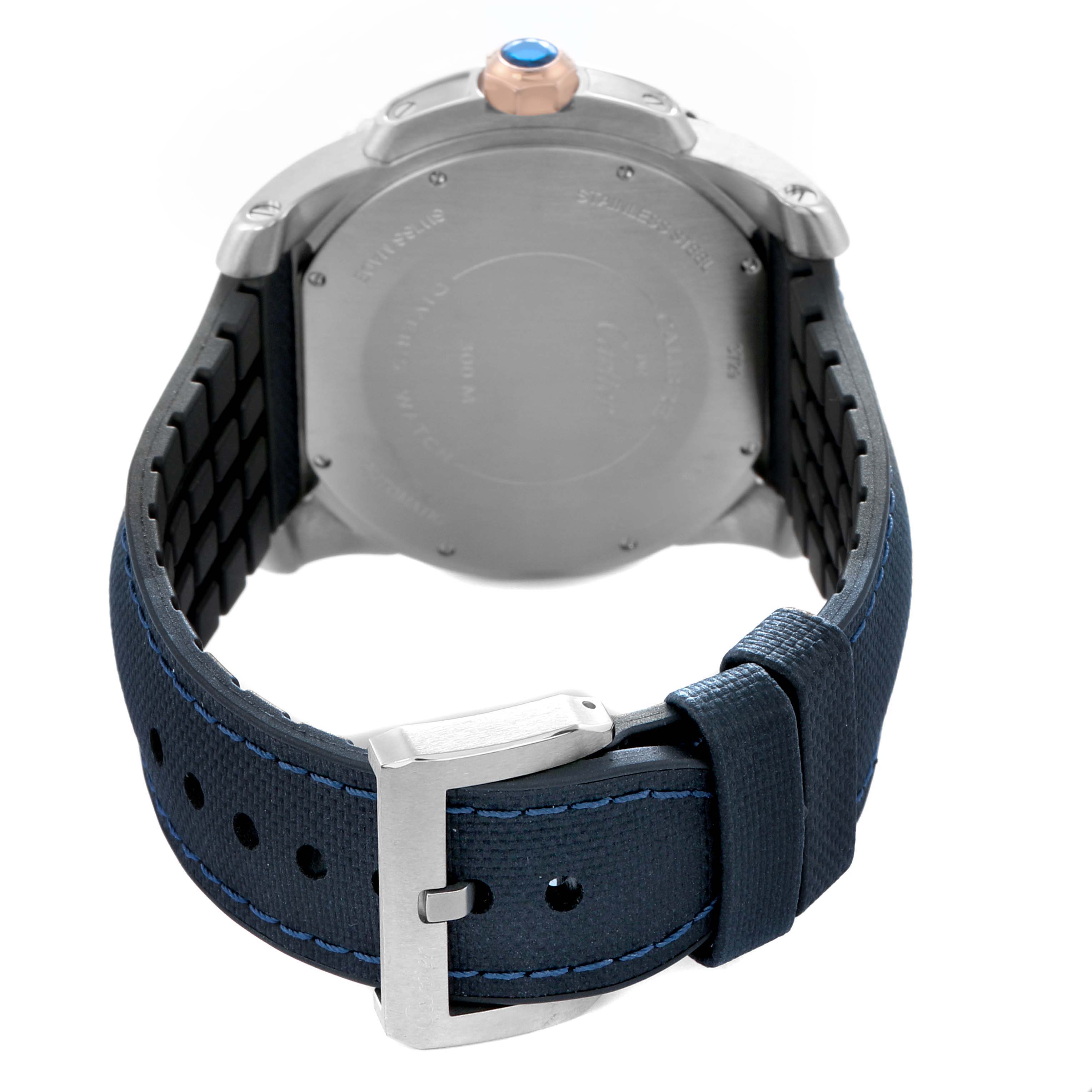 The image shows the back view of a Calibre de Cartier watch by Cartier, highlighting the case back and blue strap with a buckle.
