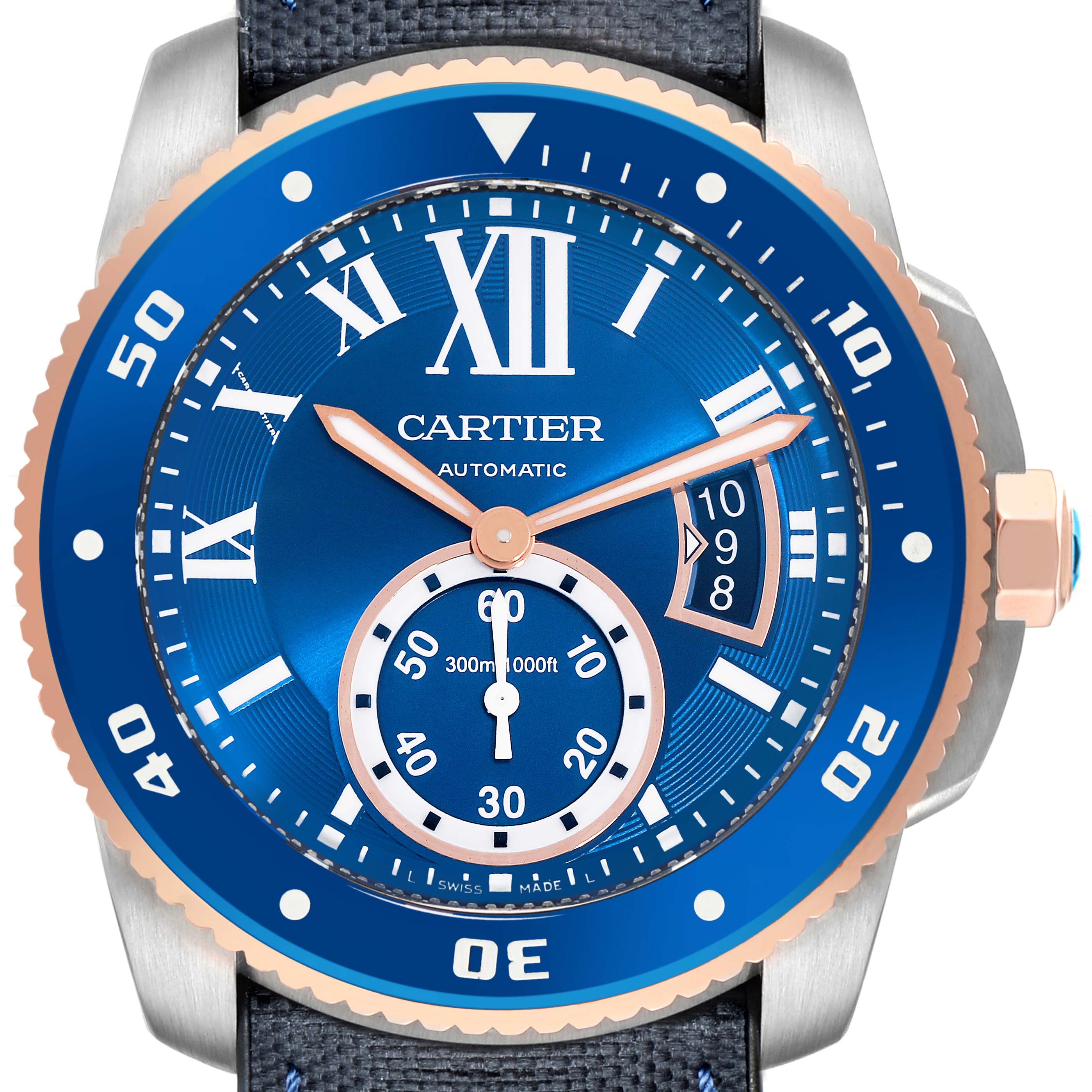 The Calibre de Cartier watch is shown from a front angle, highlighting its blue dial, bezel with numerals, and sub-dial.