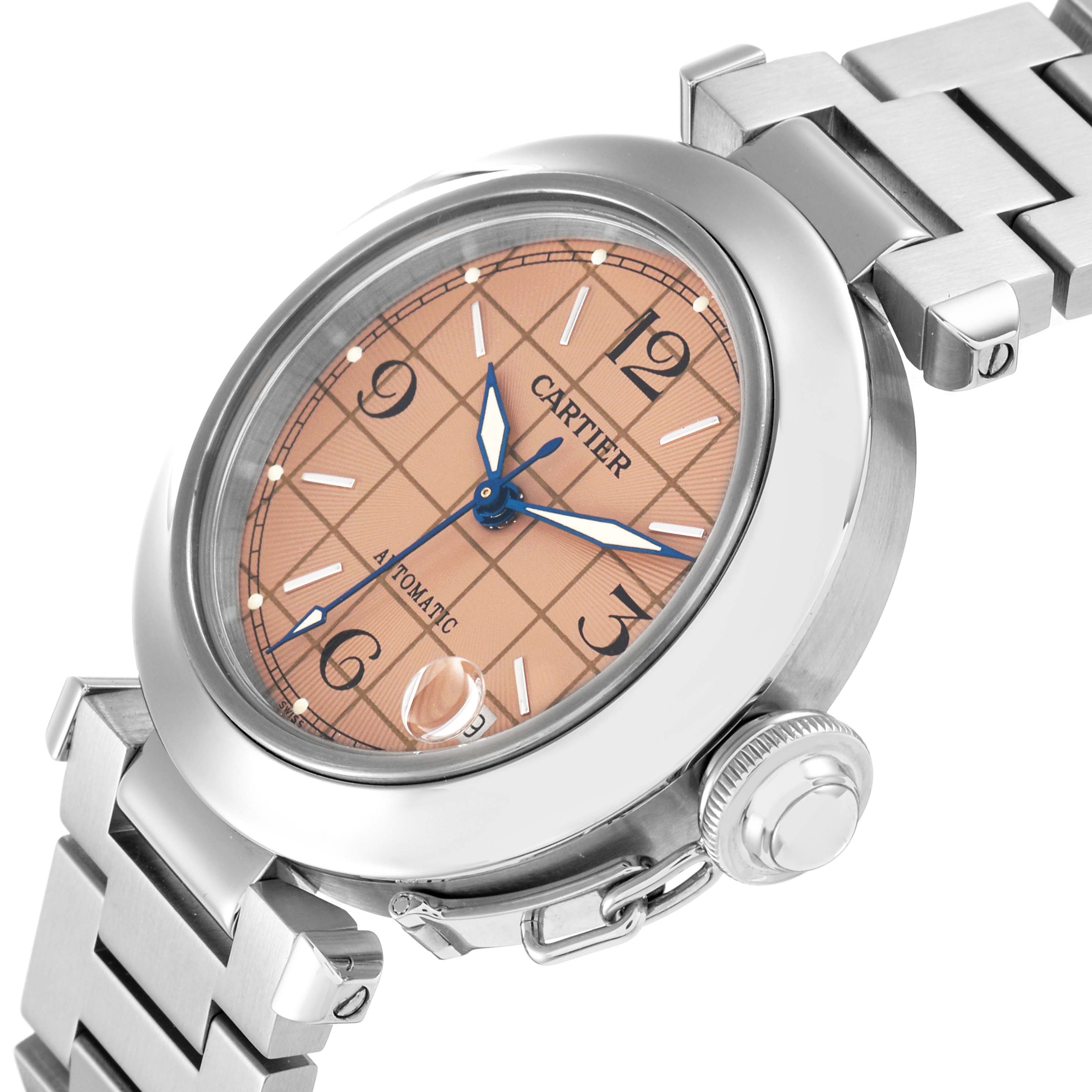 The Cartier Pasha W31024M7 Men
s Stainless Steel Pink Dial watch is shown at an angle highlighting its dial, crown, and part of the bracelet.