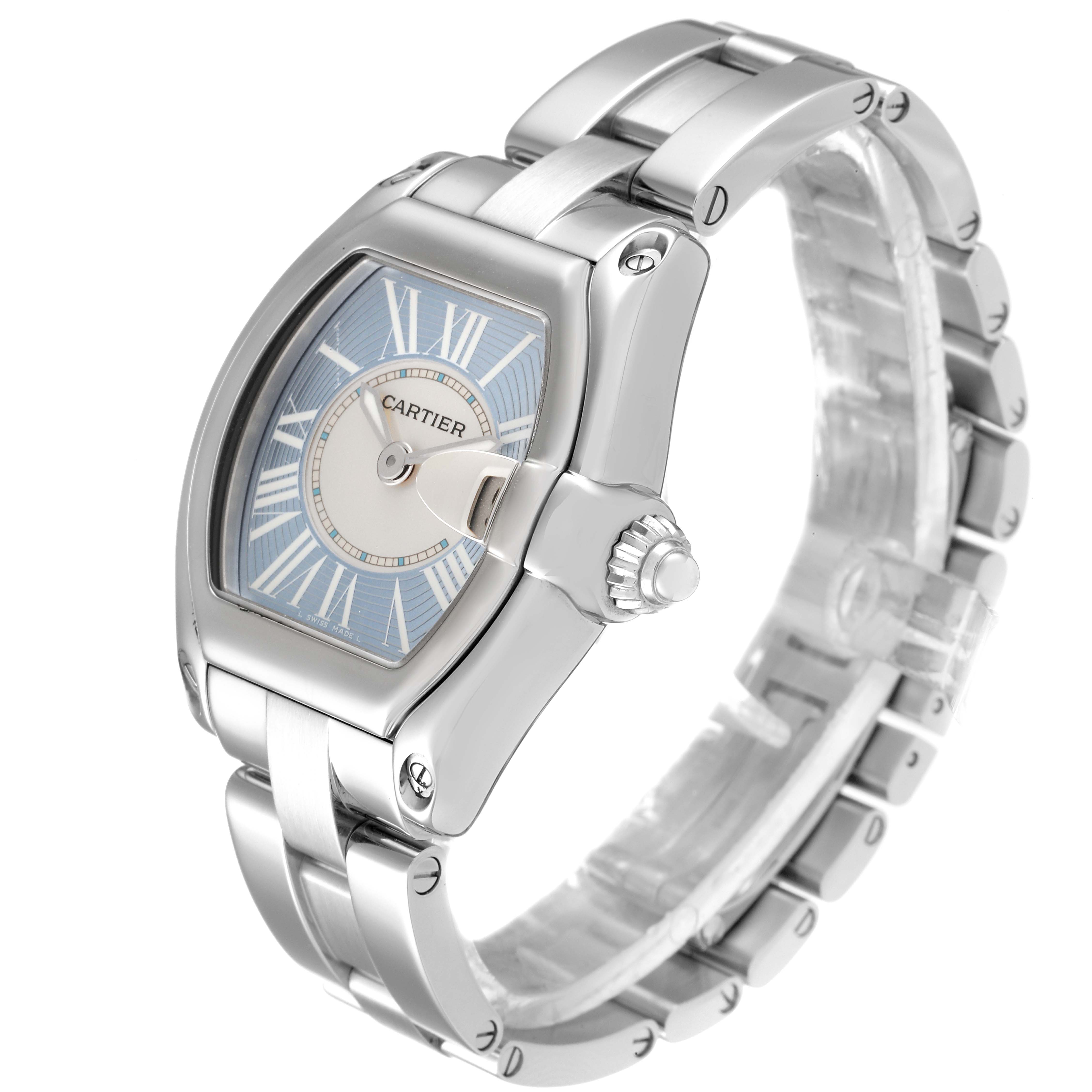 The Cartier Roadster W62053V3 Women's Stainless Steel Blue Dial W62053V3 Women's Stainless Steel Blue Dial watch is shown from an angled side view, highlighting its dial, strap, and crown.